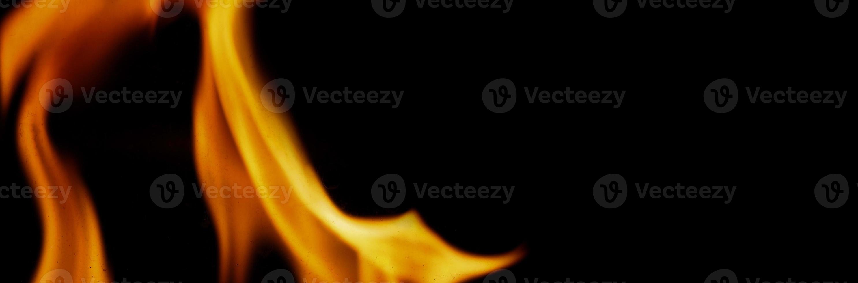 Fire background. Abstract burning flame and black background. photo