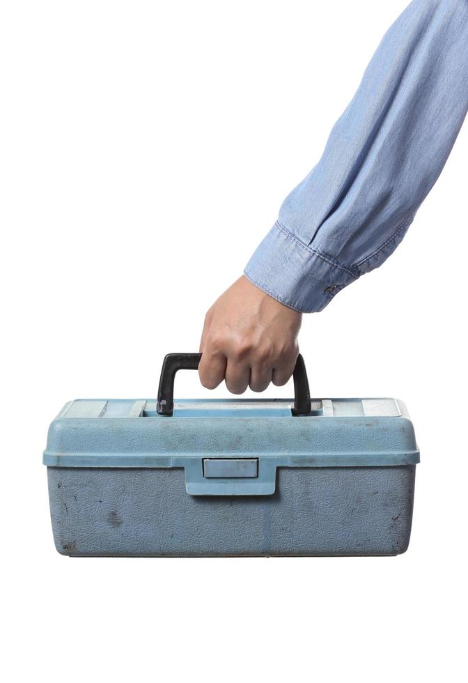 Worker holding tool box on white background photo