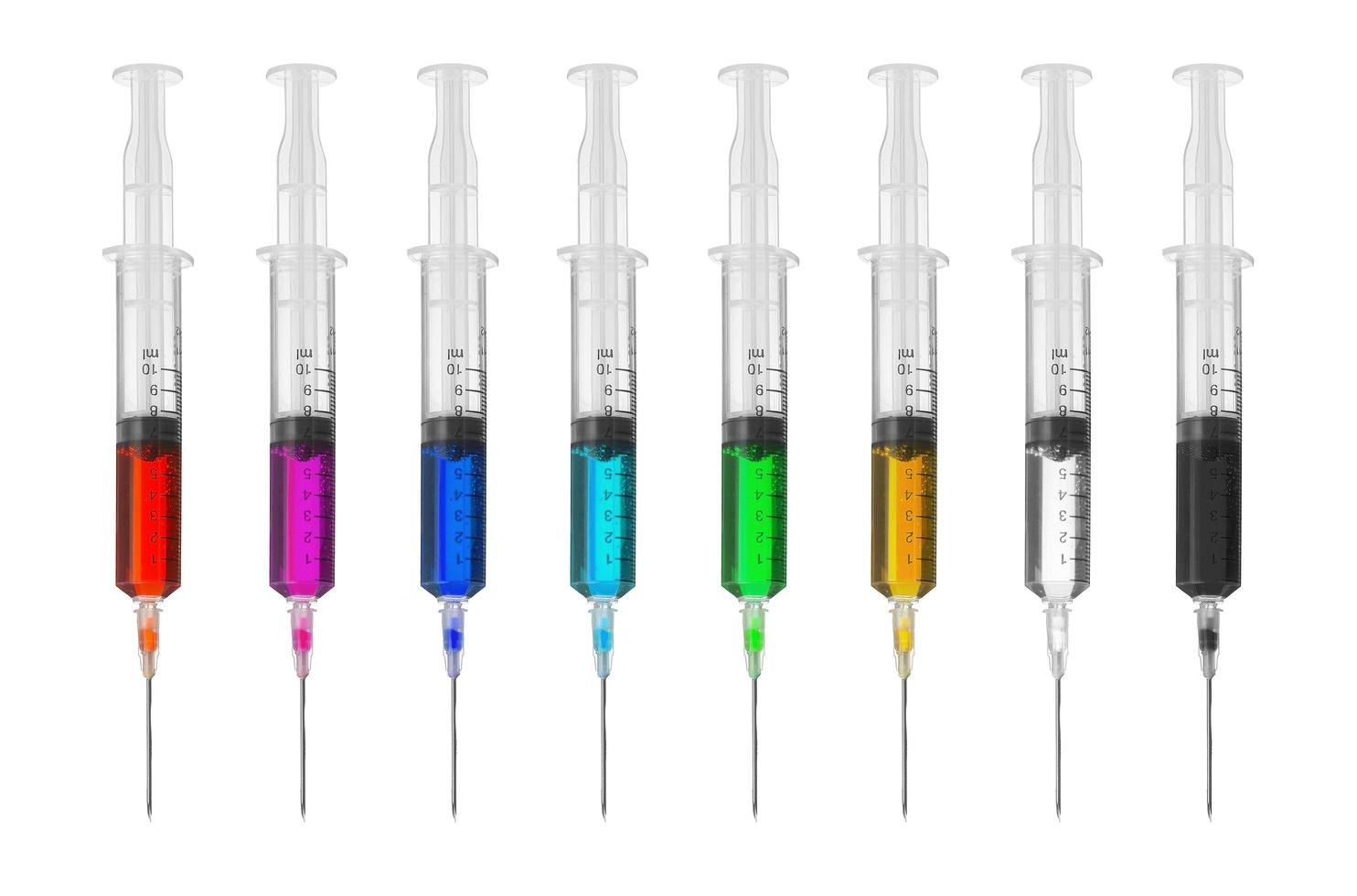 syringe and color drug on white background photo