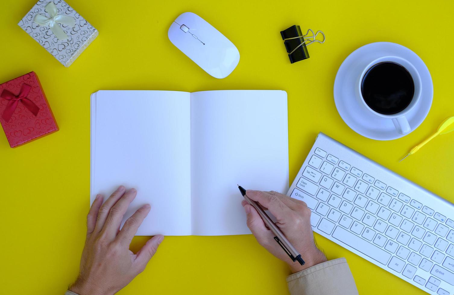 Top view of a businessman working on a desk in an office and the new regular working environment photo