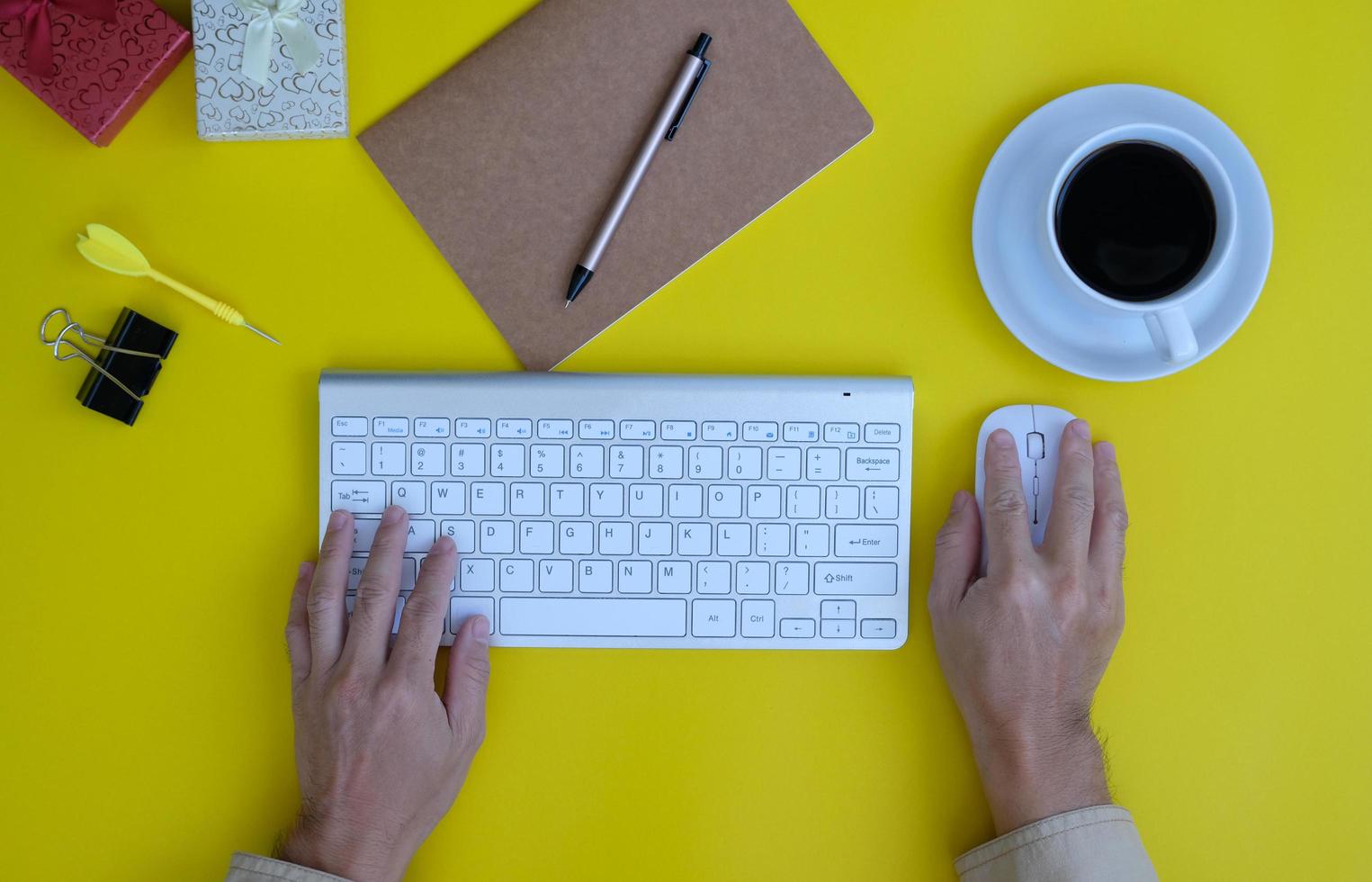 Top view of a businessman working on a desk in an office and the new regular working environment photo