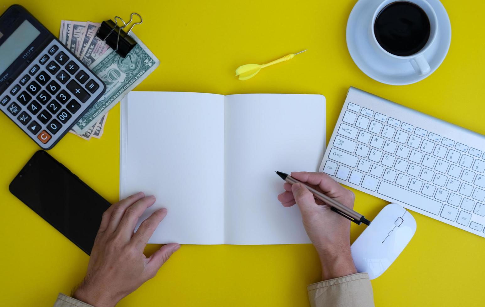 Top view of a businessman working on a desk in an office and the new regular working environment photo