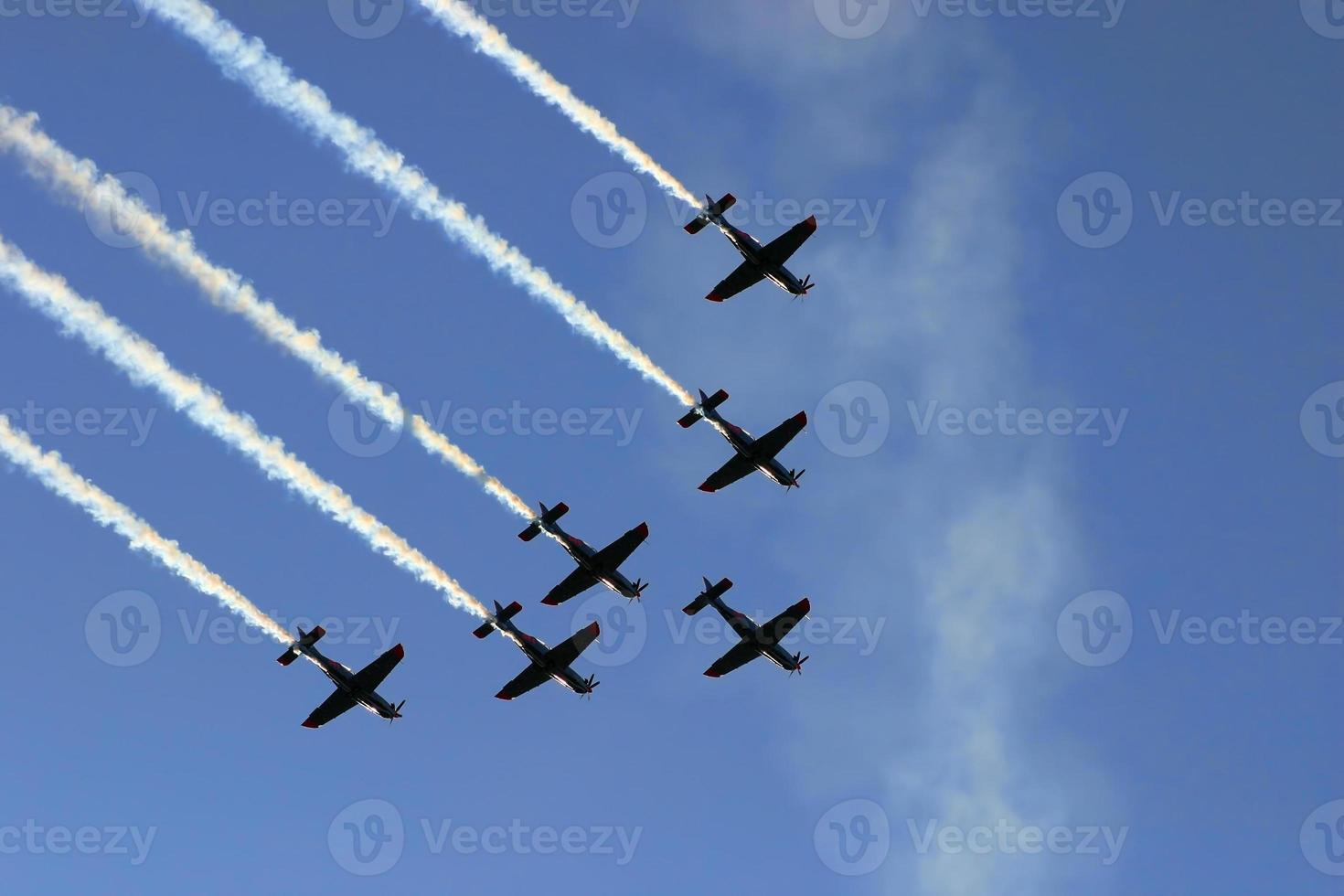 Synchronized team flight- flying in formations photo