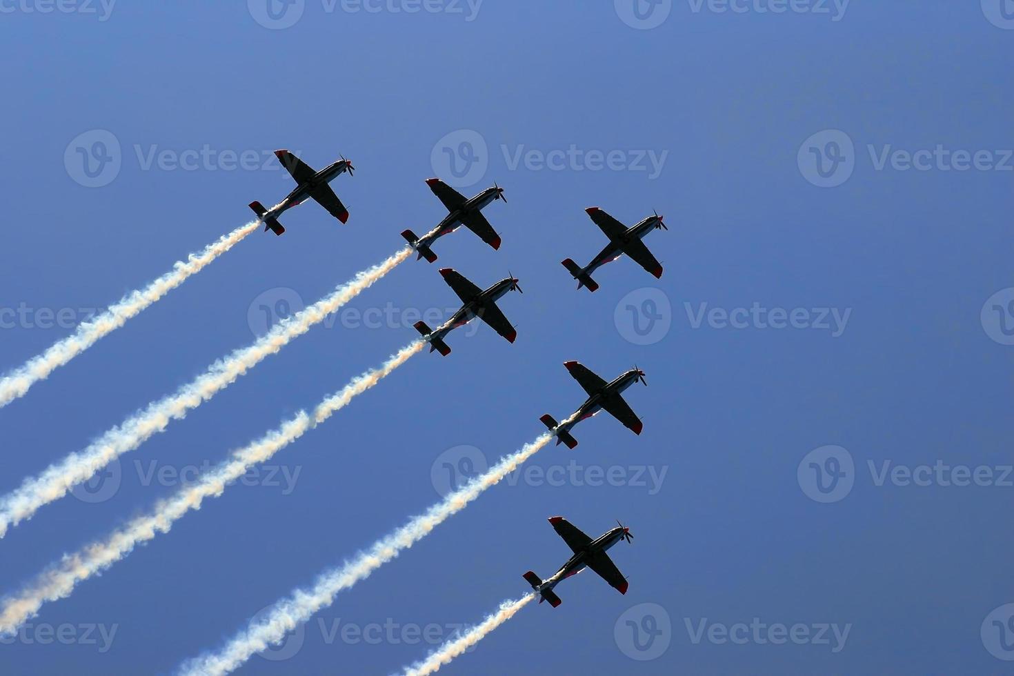 Synchronized team flight- flying in formations photo