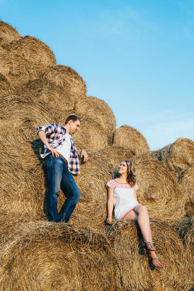 a guy with a girl on a summer walk in the field photo