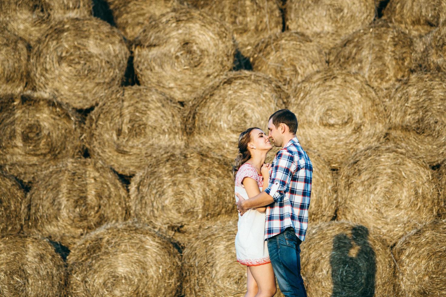 a guy with a girl on a summer walk in the field photo