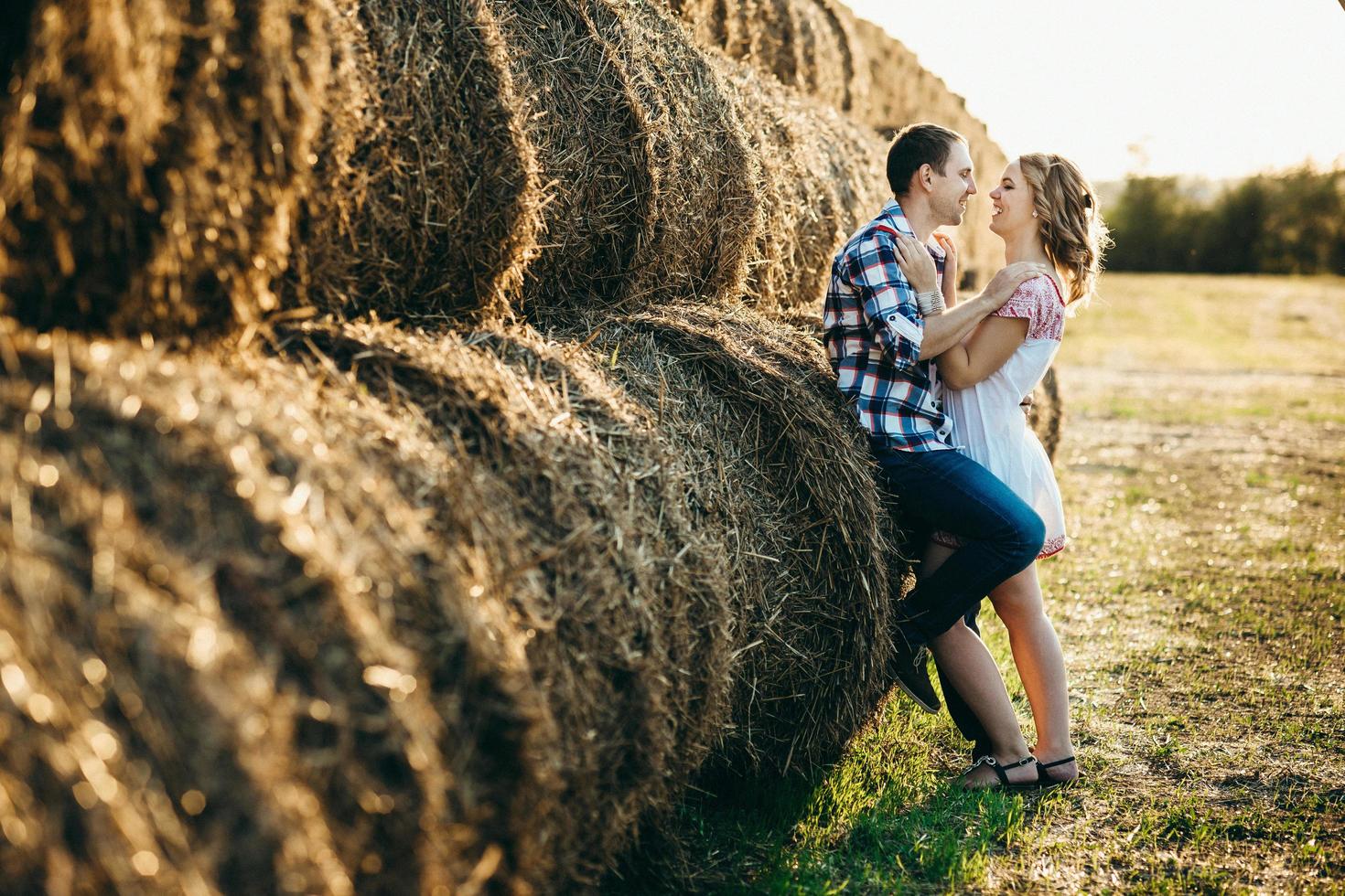 a guy with a girl on a summer walk in the field photo