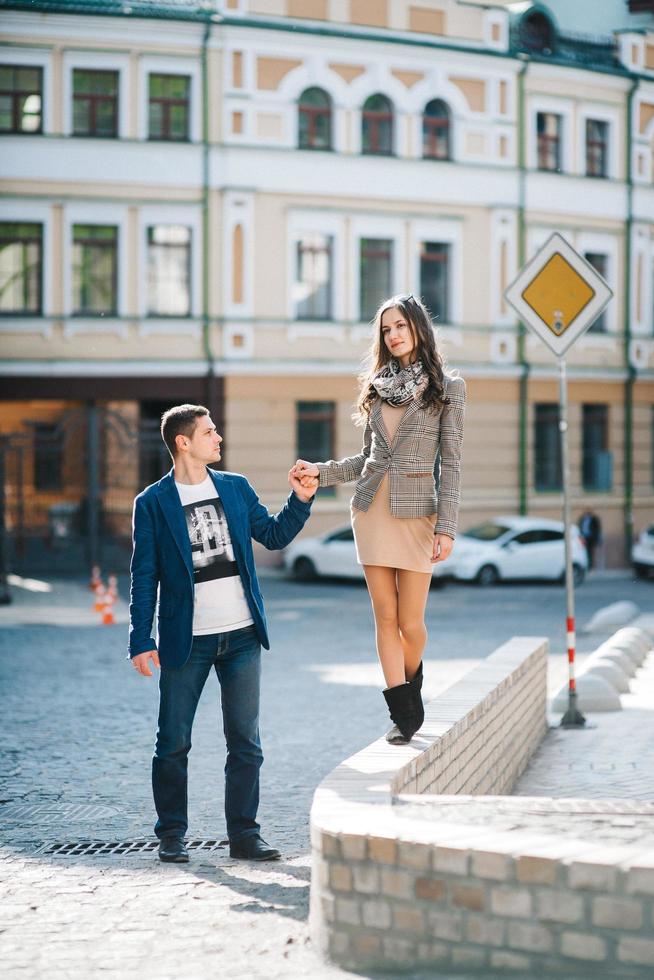 guy and a girl happily walk in the morning on the empty streets photo