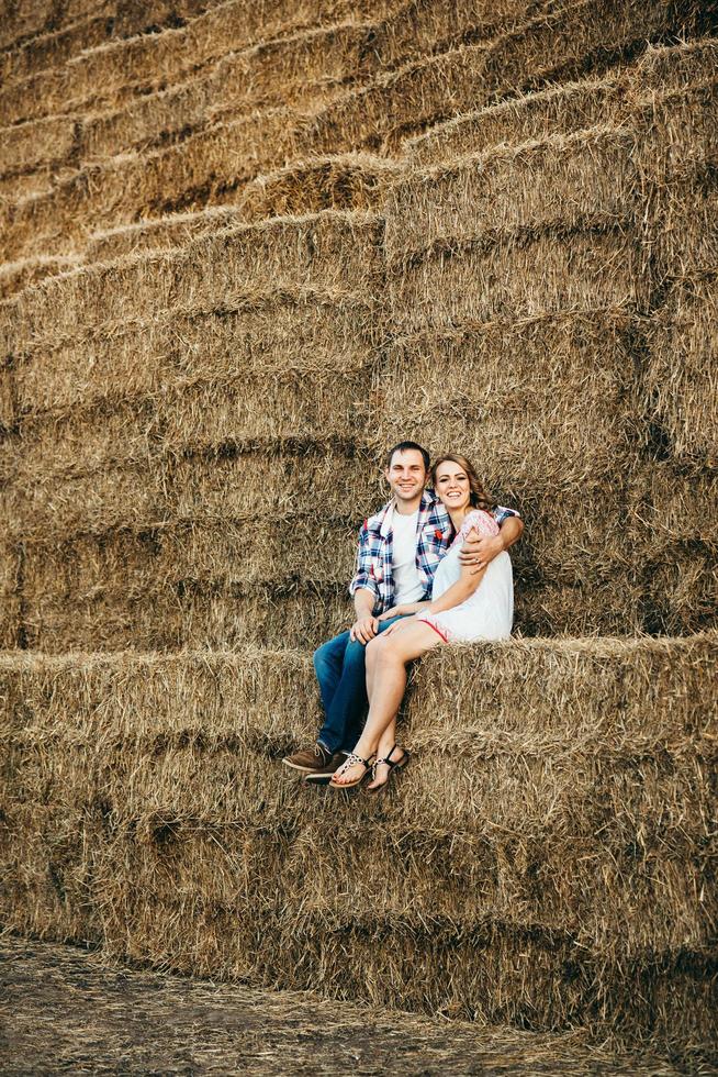 a guy with a girl on a summer walk in the field photo