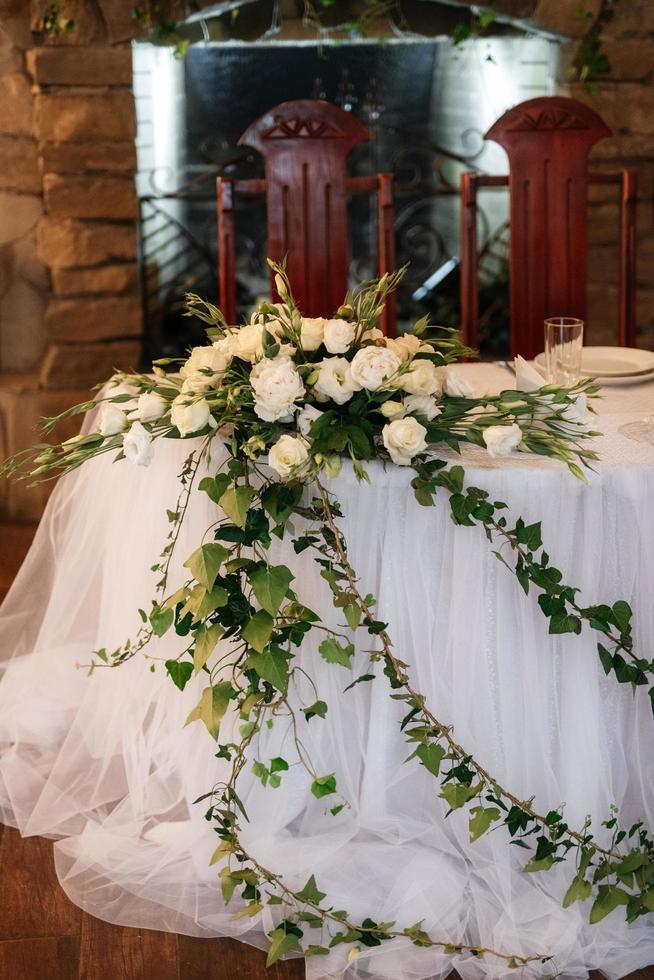 The presidium of the newlyweds in the banquet hall of the restaurant photo