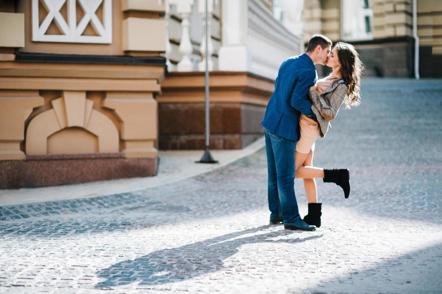 guy and a girl happily walk in the morning on the empty streets photo