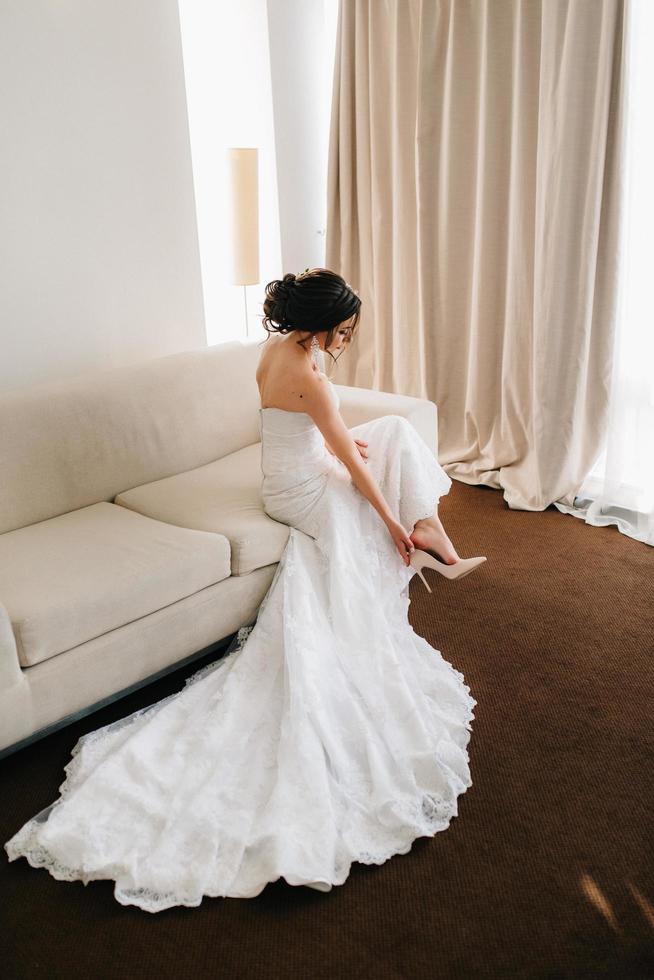 bride in a white dress with a bouquet photo