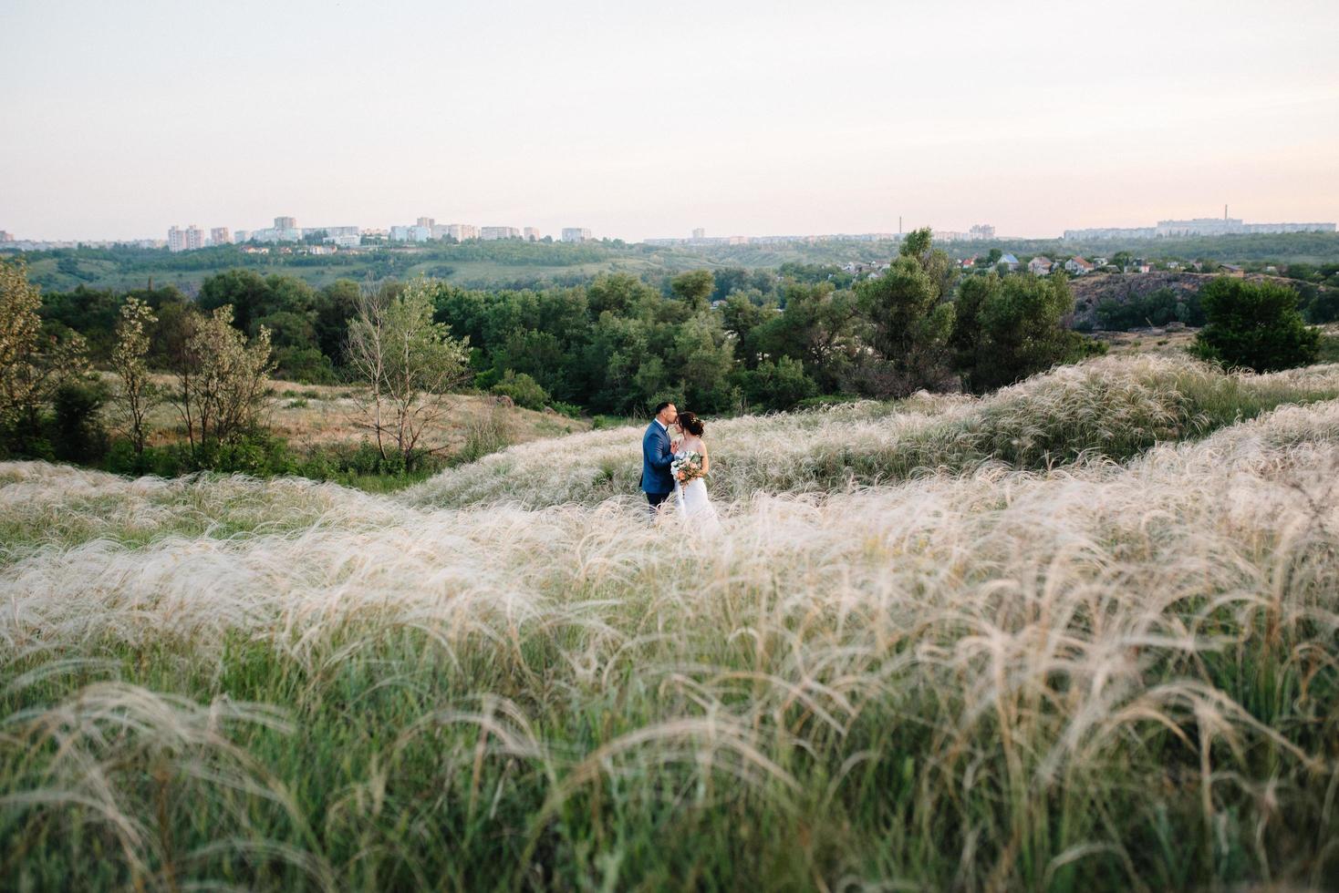 A couple in love a guy and a girl on a walk in the forest belt photo