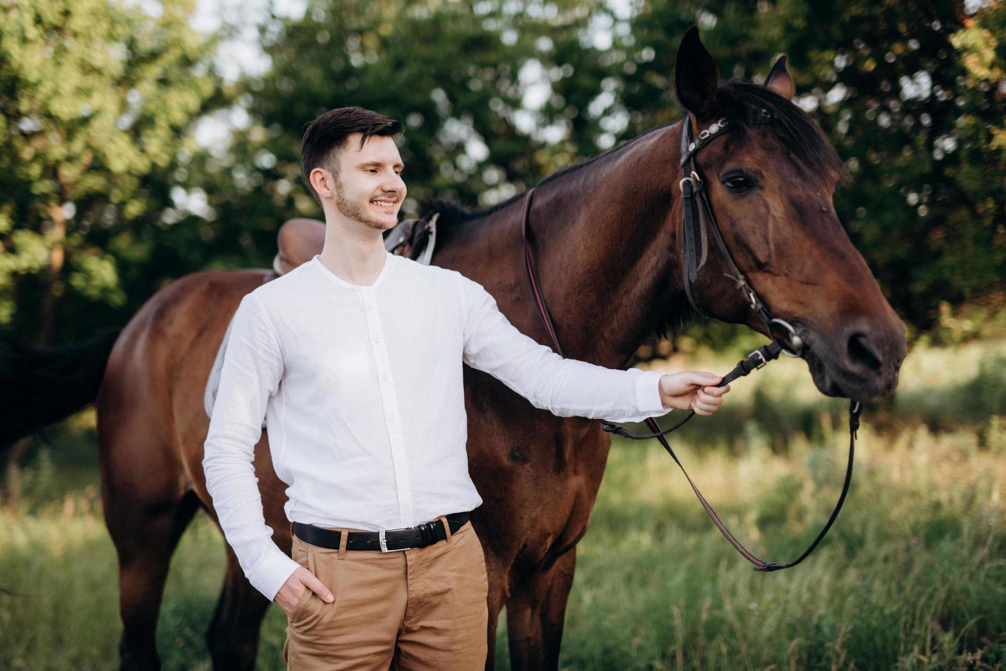 guy in a white shirt on a walk with brown horses 4734773 Stock Photo at ...