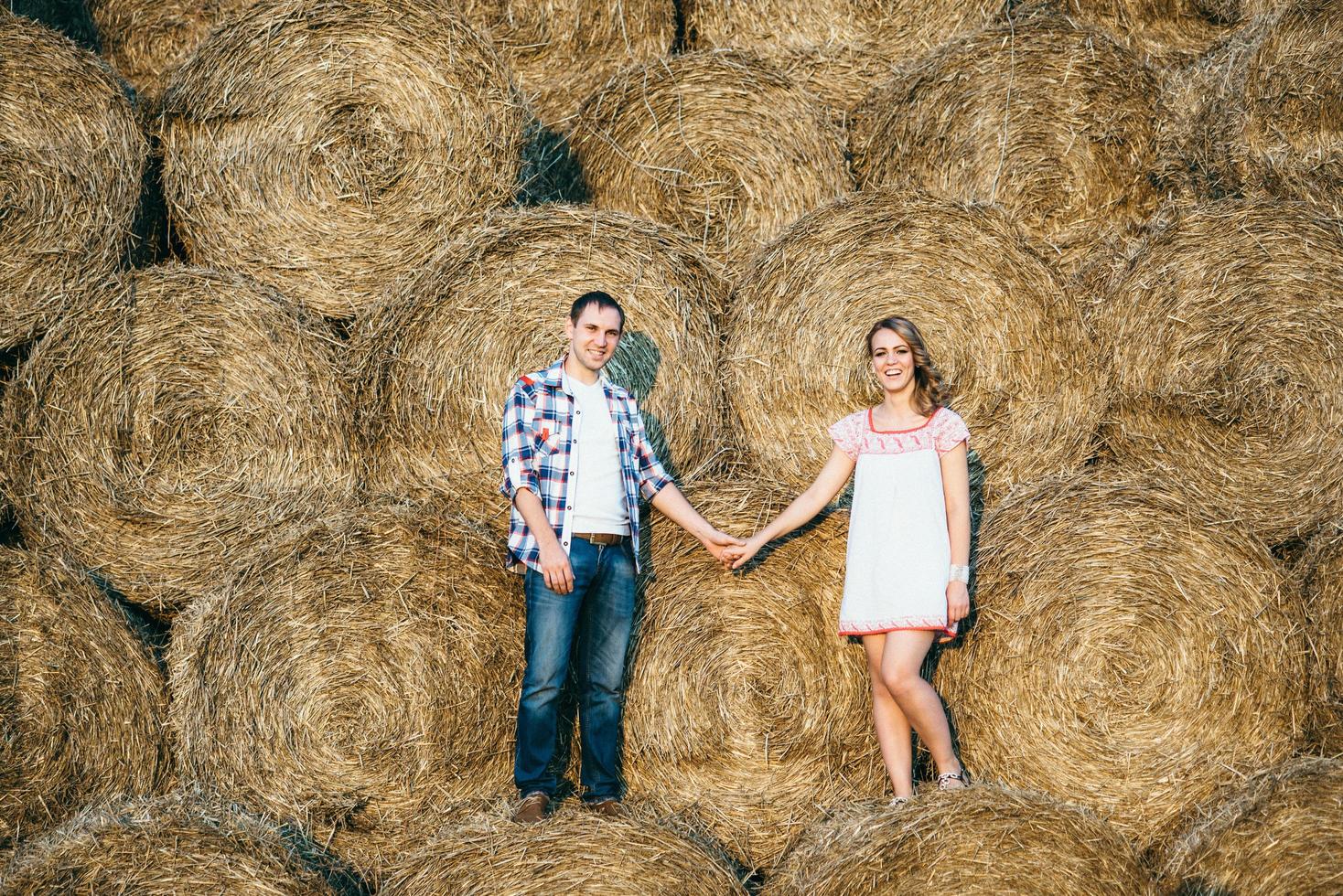 a guy with a girl on a summer walk in the field photo