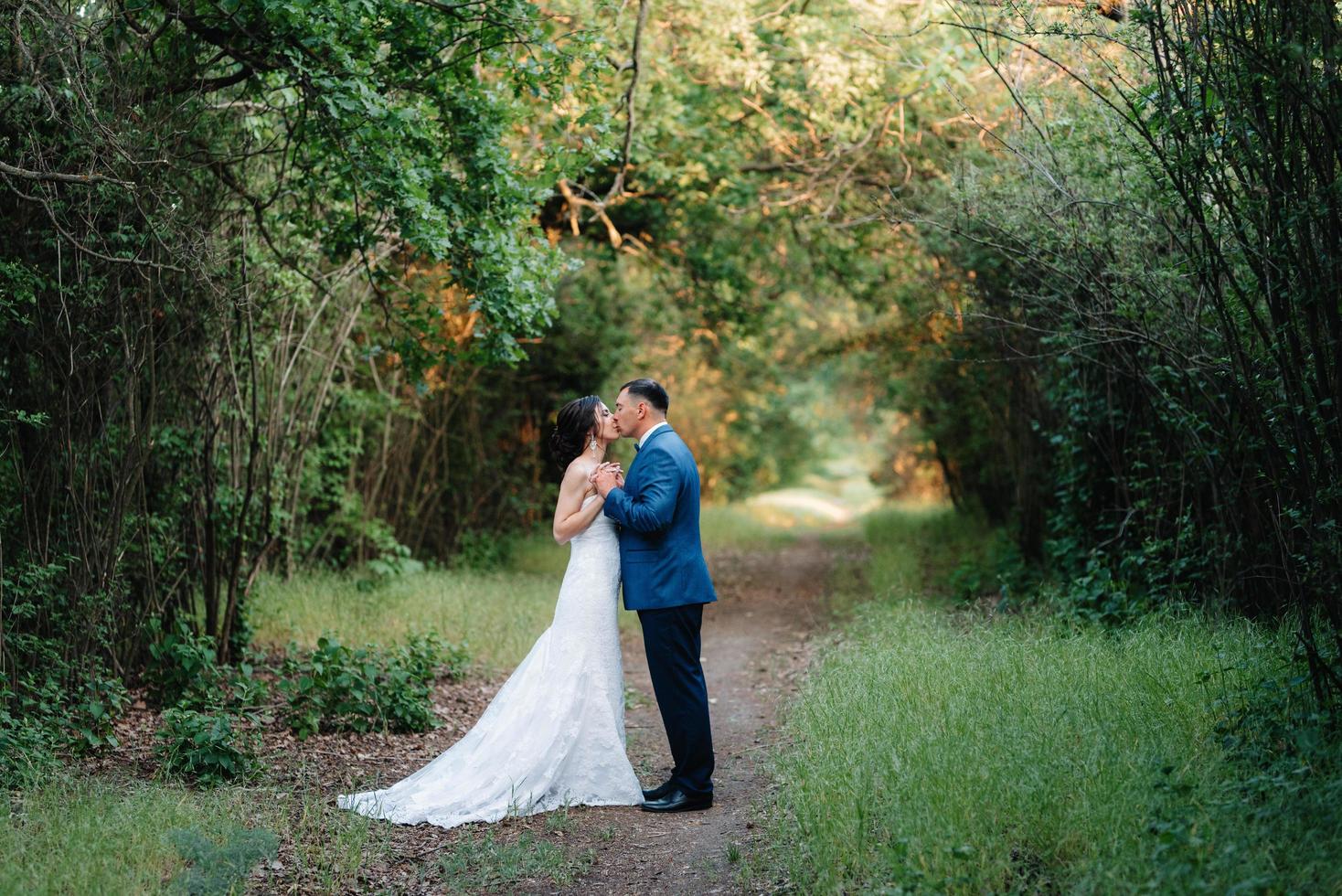 A couple in love a guy and a girl on a walk in the forest belt photo