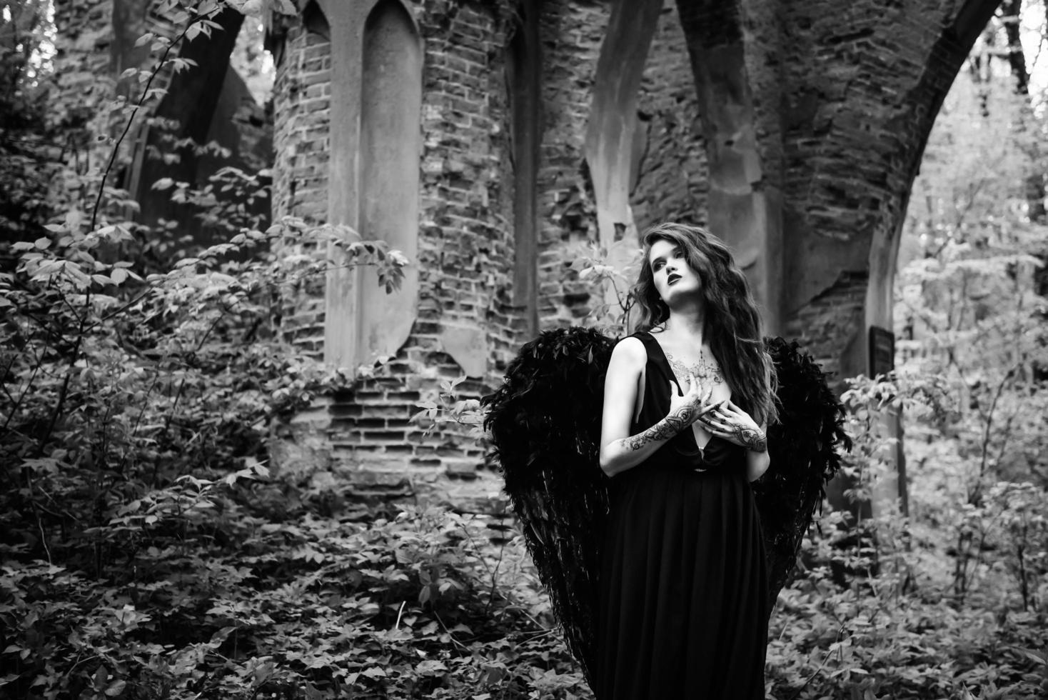 Fallen angel with black wings photo