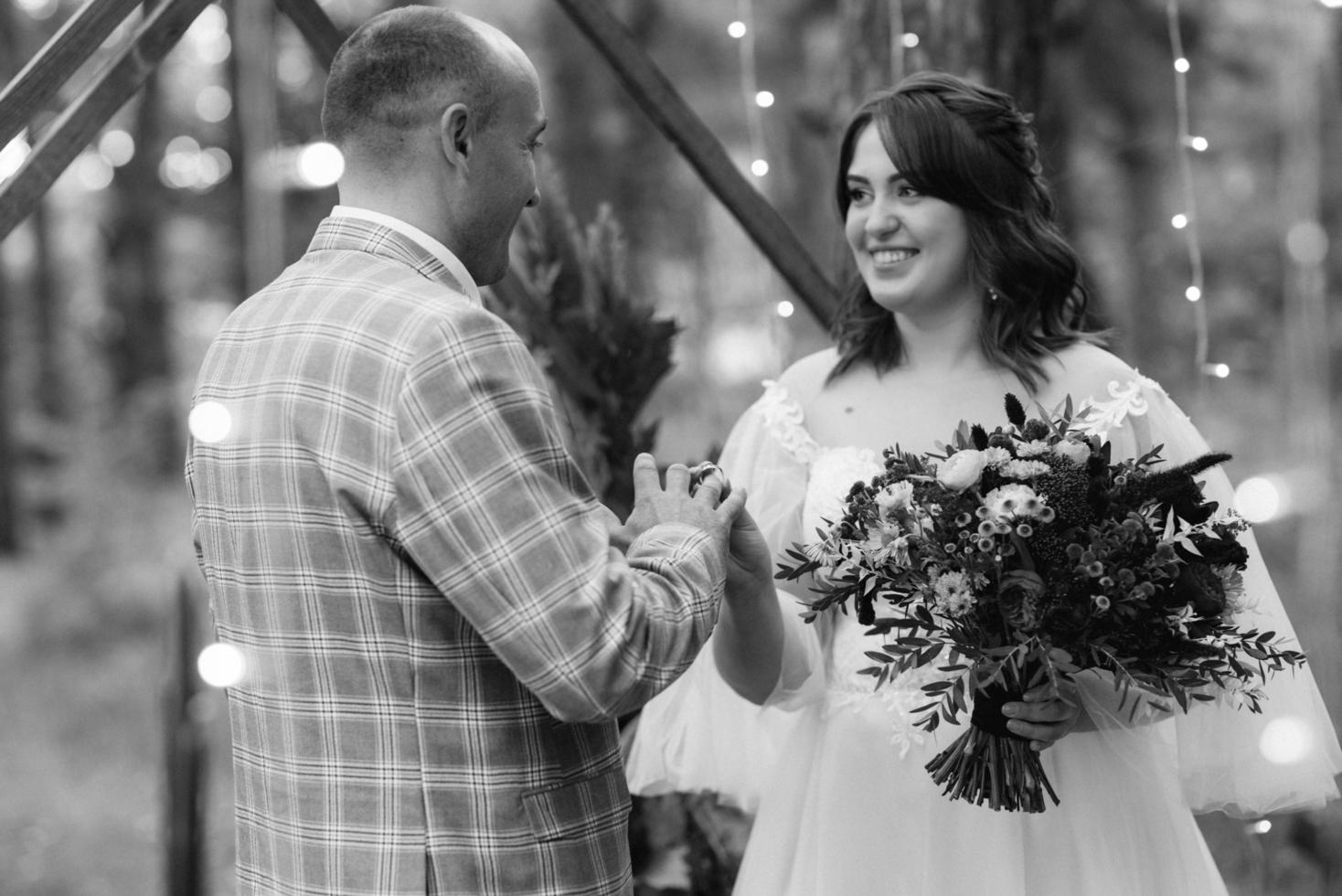 man and woman got engaged in autumn forest photo