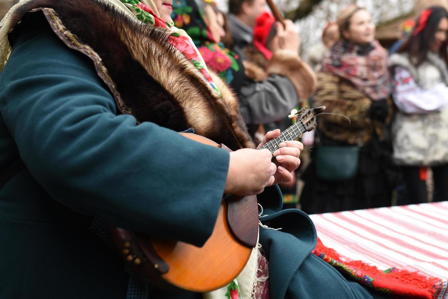 The Ukrainian folk song and dance ensemble in national costumes photo