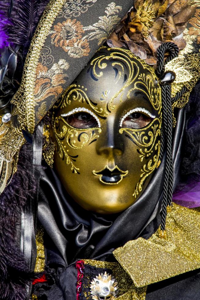 VENICE, ITALY 2013 - Person with Venetian carnival mask photo