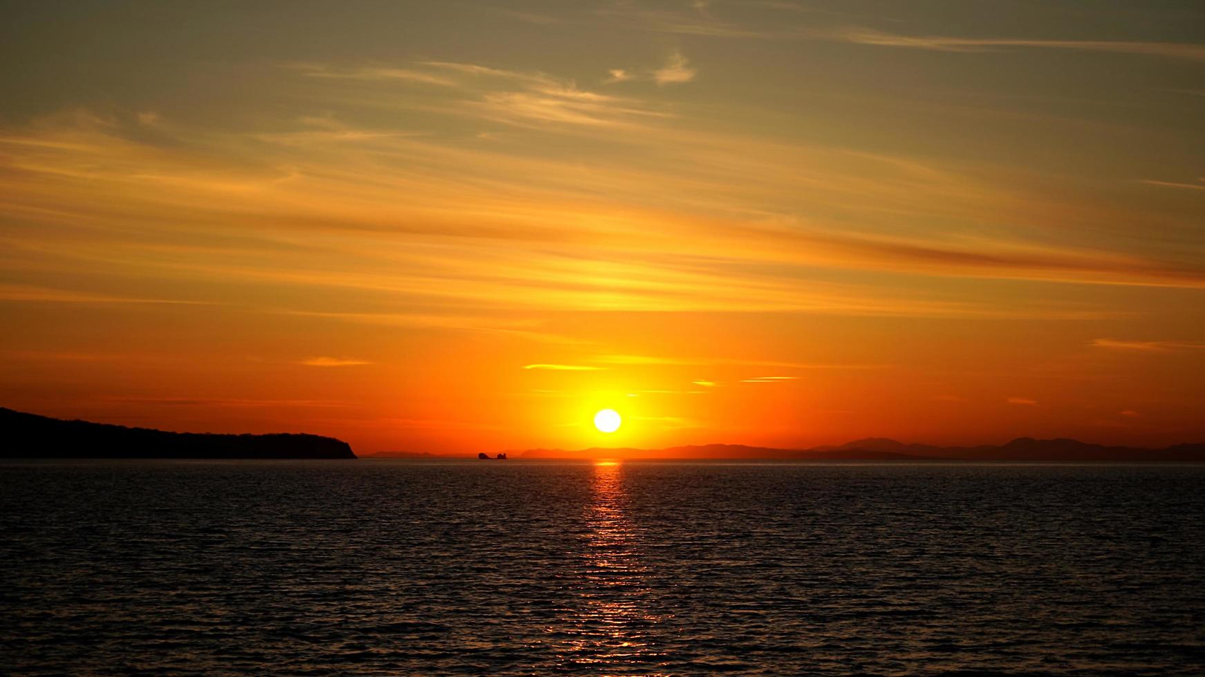 Beautiful background with sunset over the sea photo