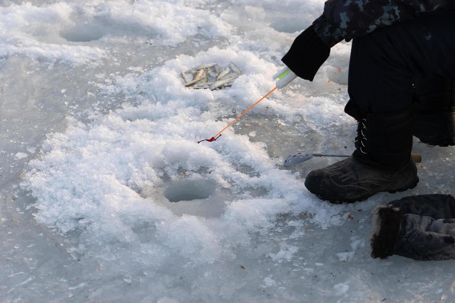 Winter fishing, ice fishing. Vladivostok, Russia photo