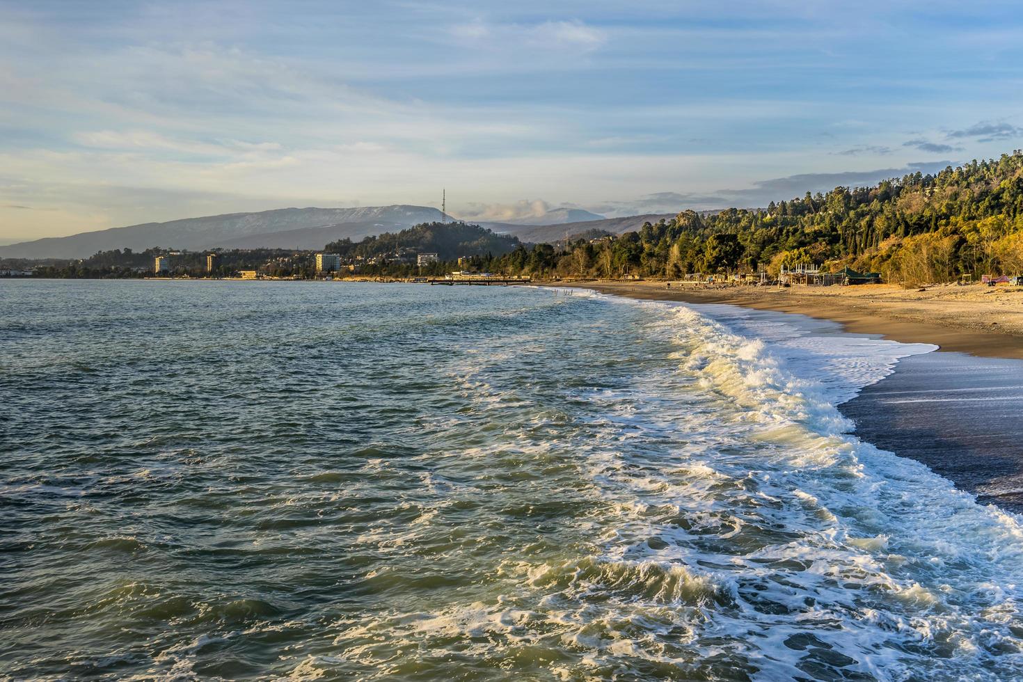 Waves splash on the shore photo