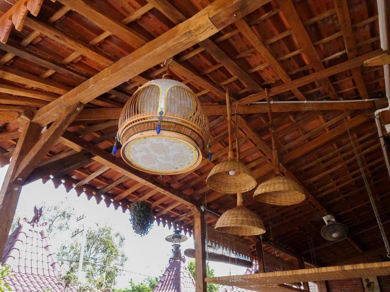 Ancient lamp hanging on the ceiling in traditional building photo
