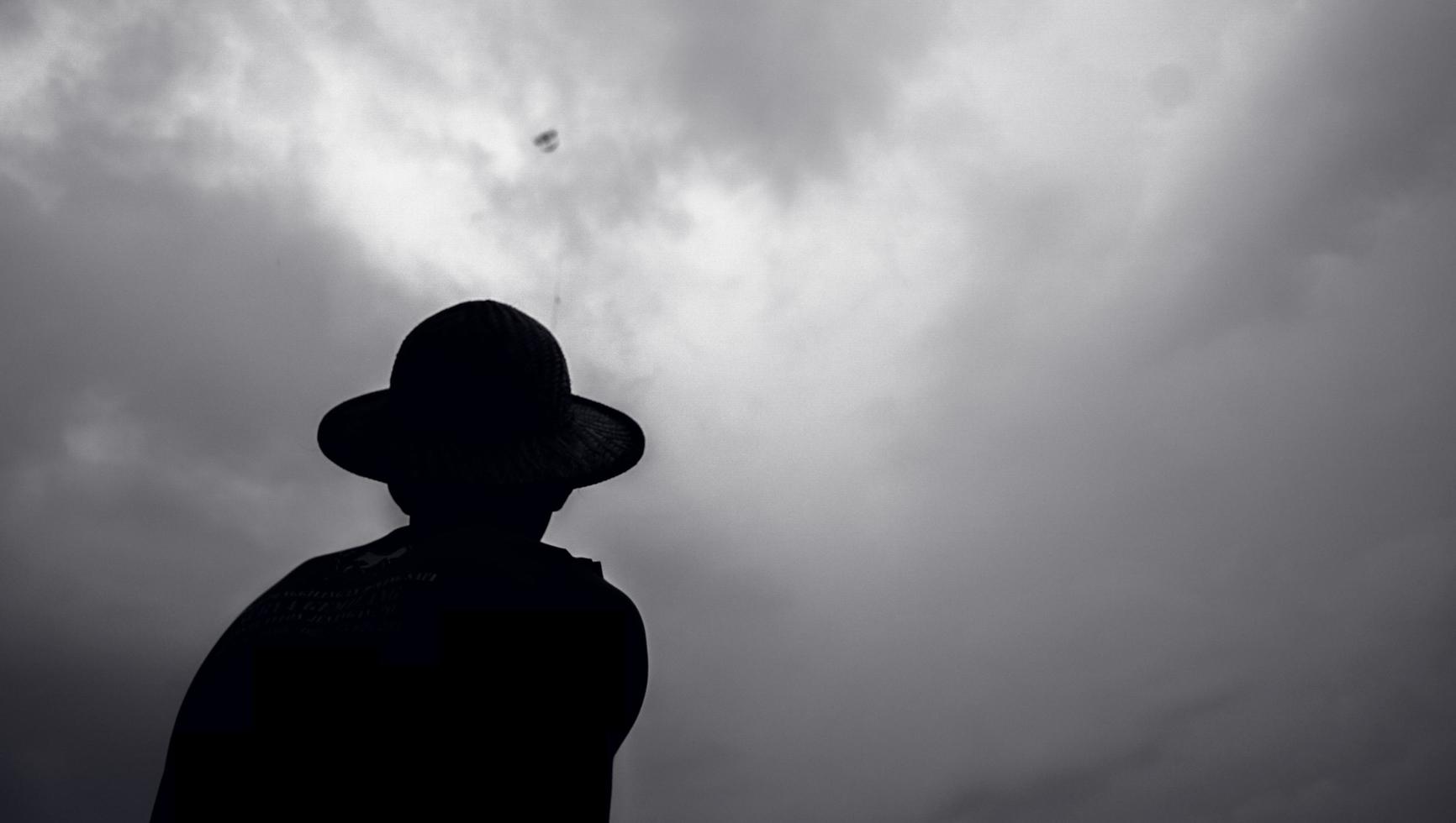 Ponorogo, Indonesia 2021 - Silhouette of a man with traditional kite photo