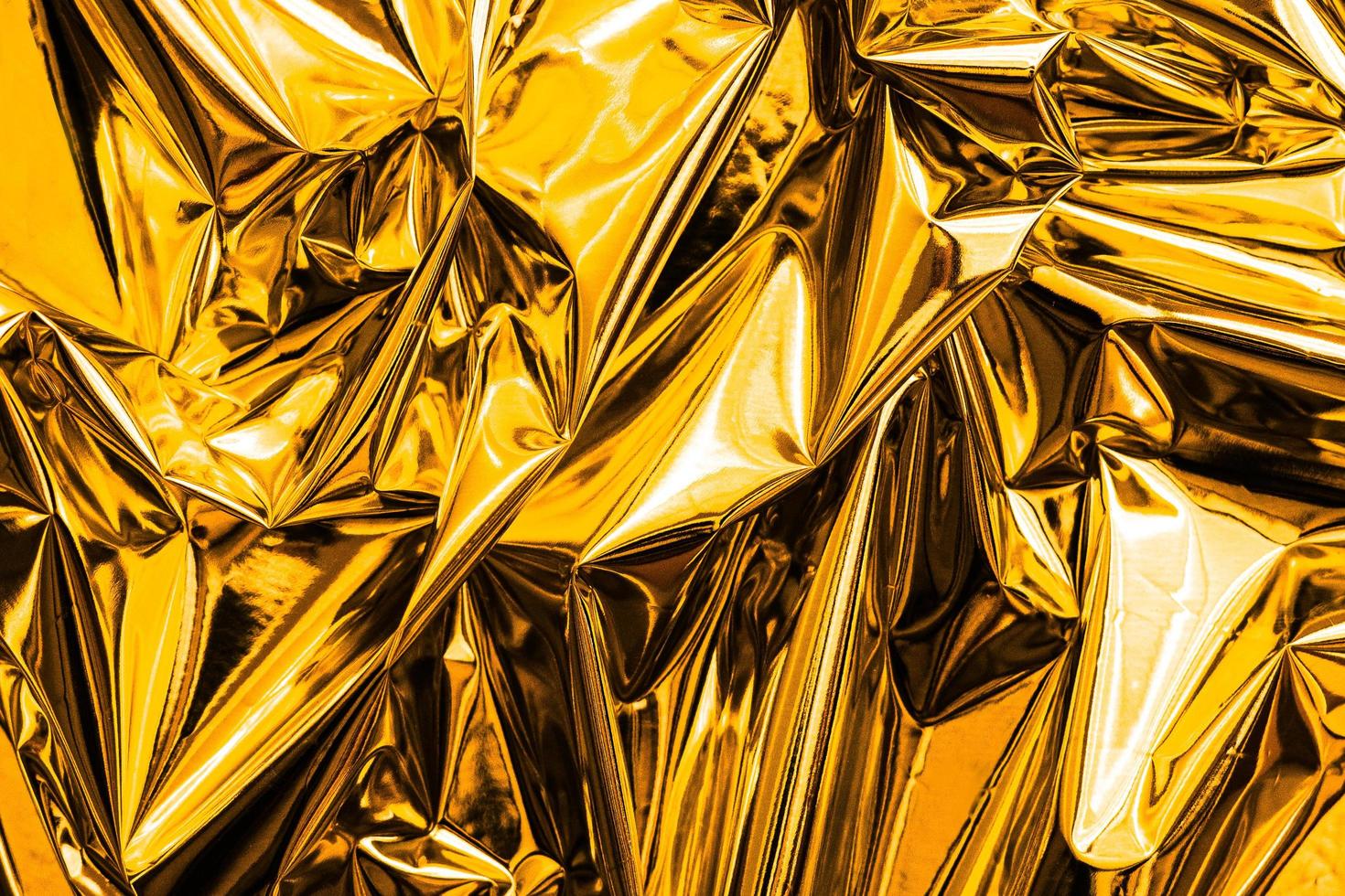 Crumpled gold abstract texture background photo