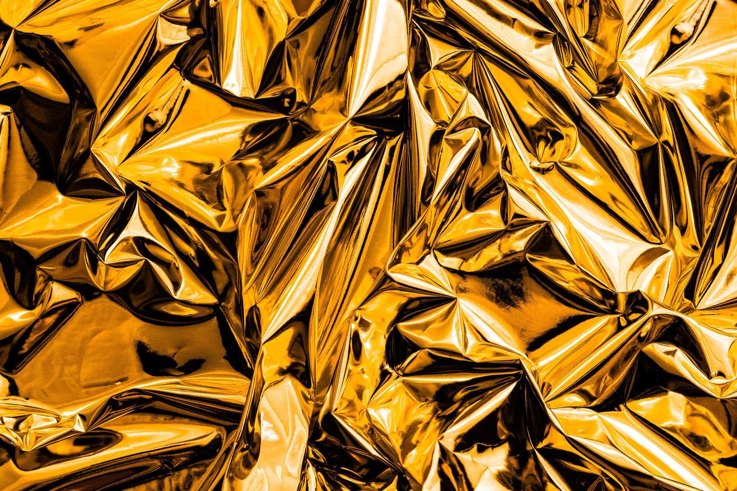 Fondo de textura abstracta de oro arrugado foto