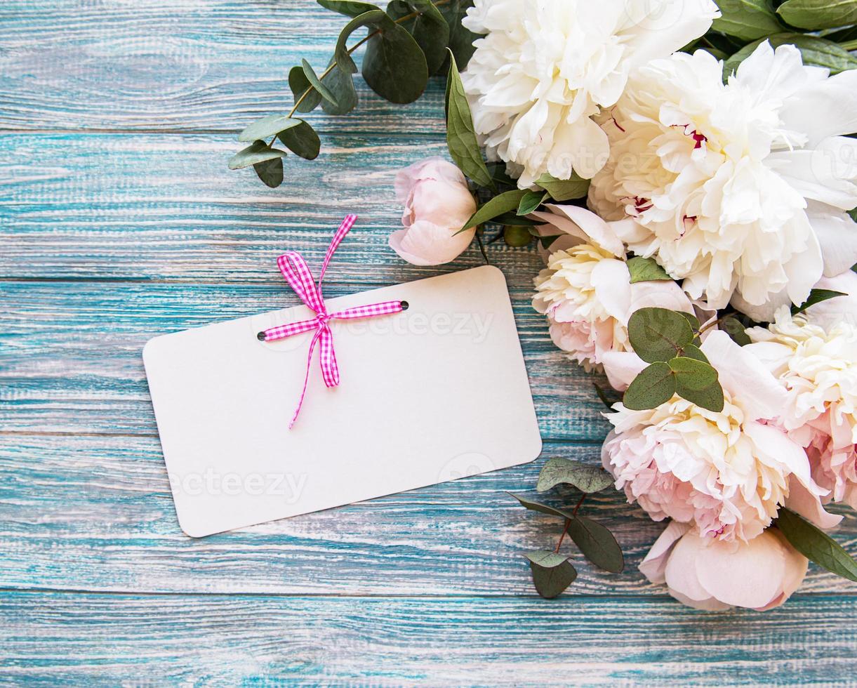 Wedding invitation with pink peonies photo