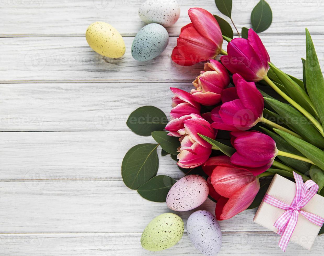 Decorative Easter eggs and tulips photo