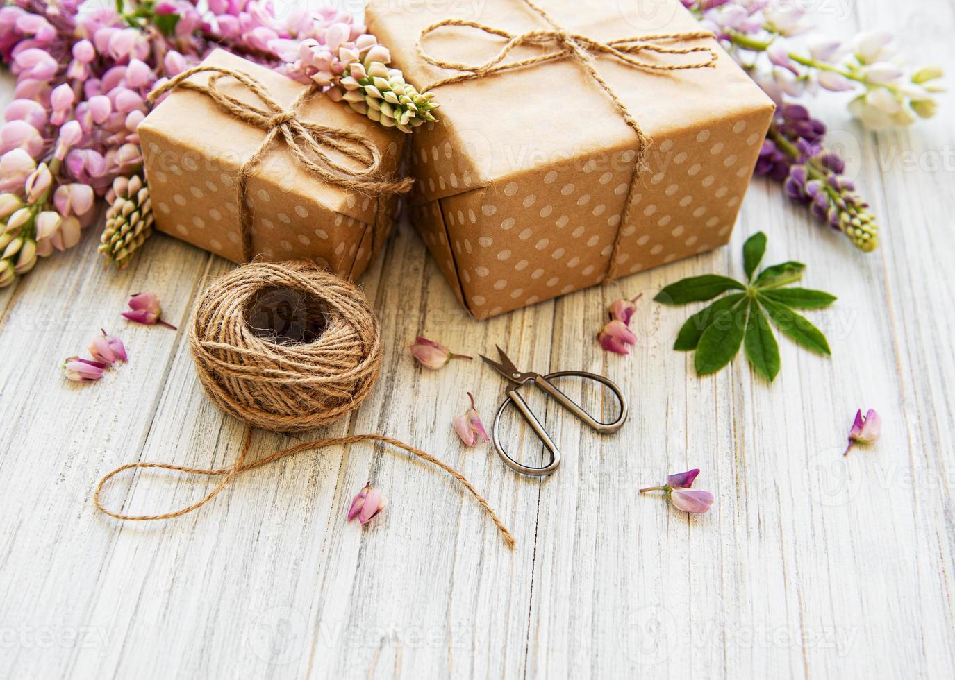 Lupine flowers and gift boxes photo