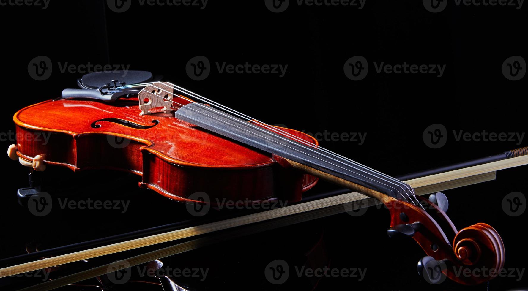 Violin on a black background, close-up. music concept. Details of the violin photo