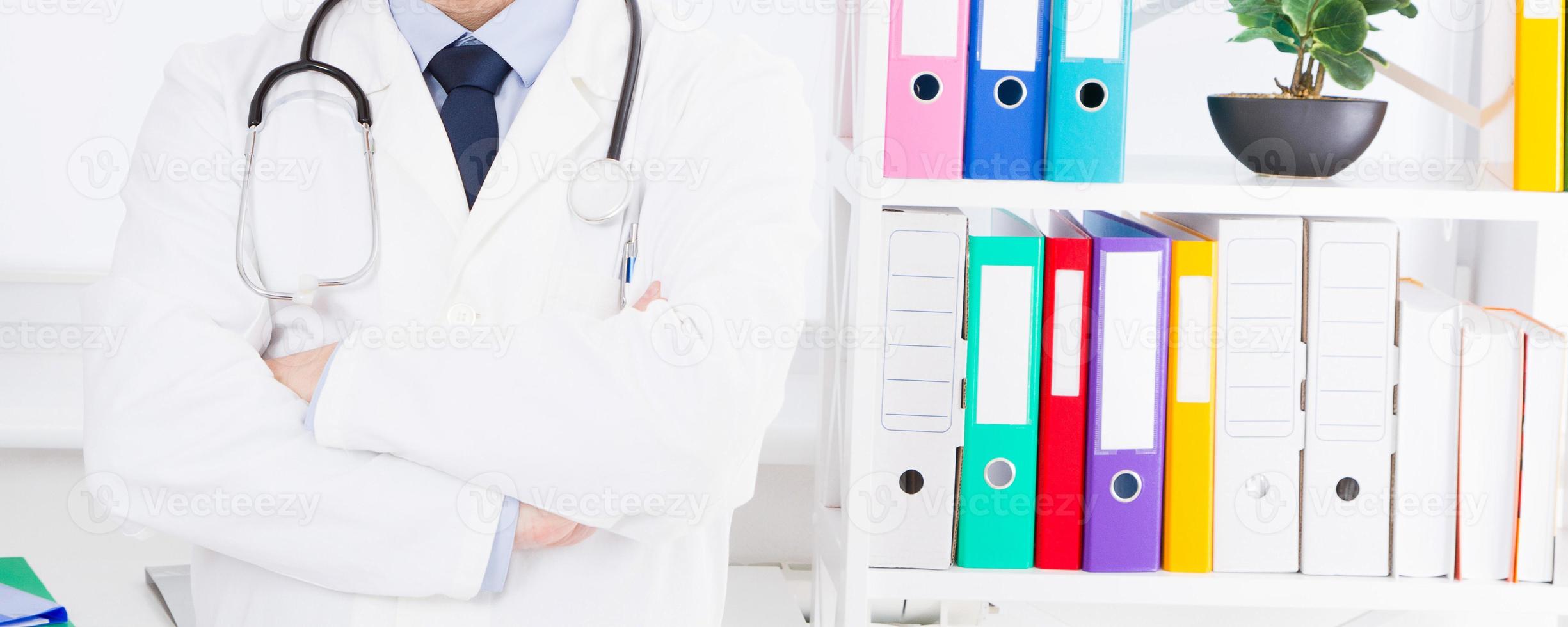 Portrait of senior doctor in medical office photo