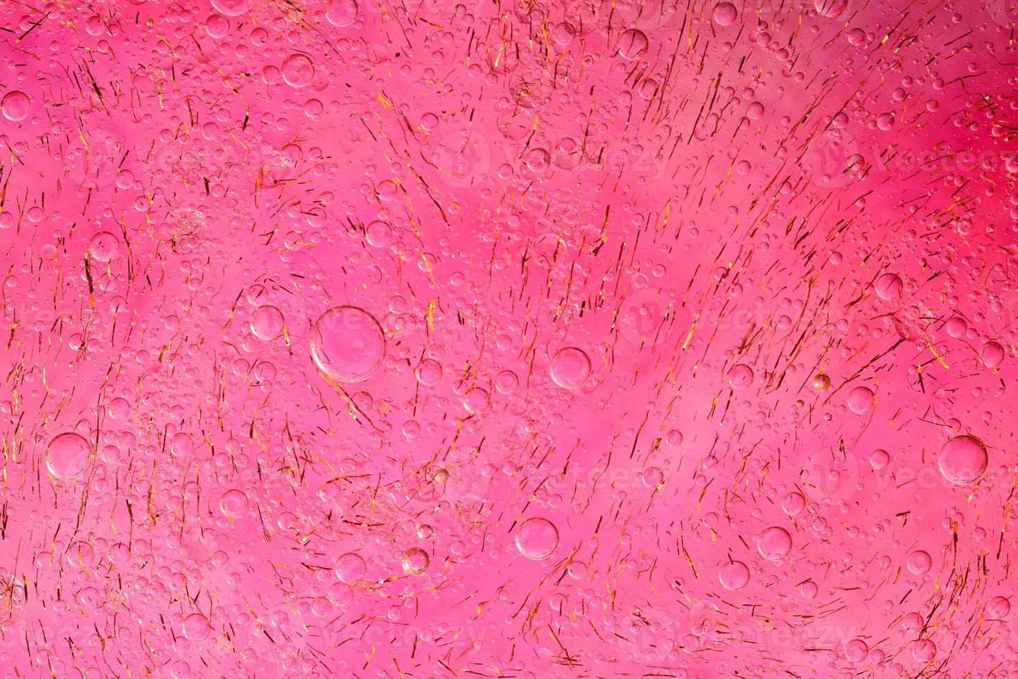 Photo of oil on a water surface with bubbles.soft pink. Abstract colorful background.