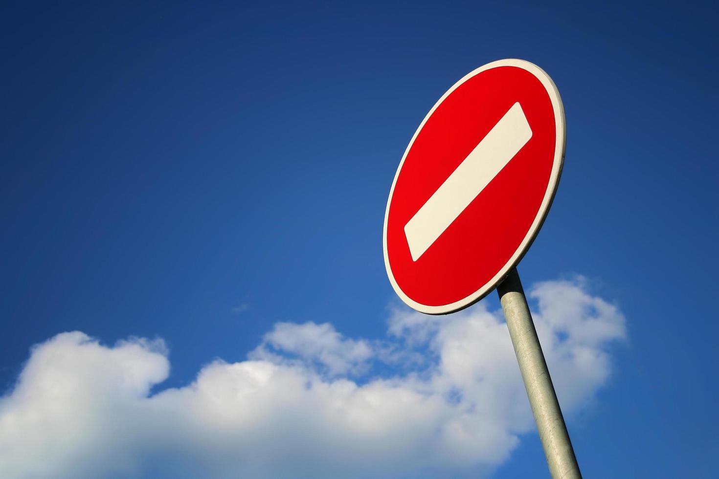 No entry traffic sign against clear blue sky photo