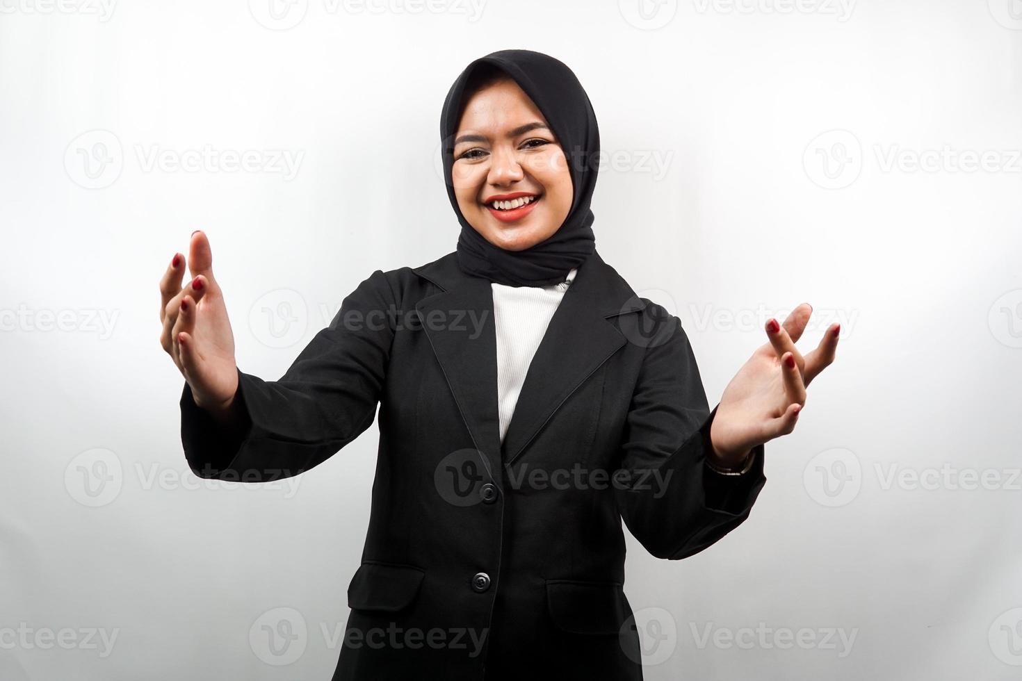 Beautiful young asian muslim business woman smiling cheerfully, with open arms to camera, welcome sign hand, hand sign wanting to hug, isolated on white background photo