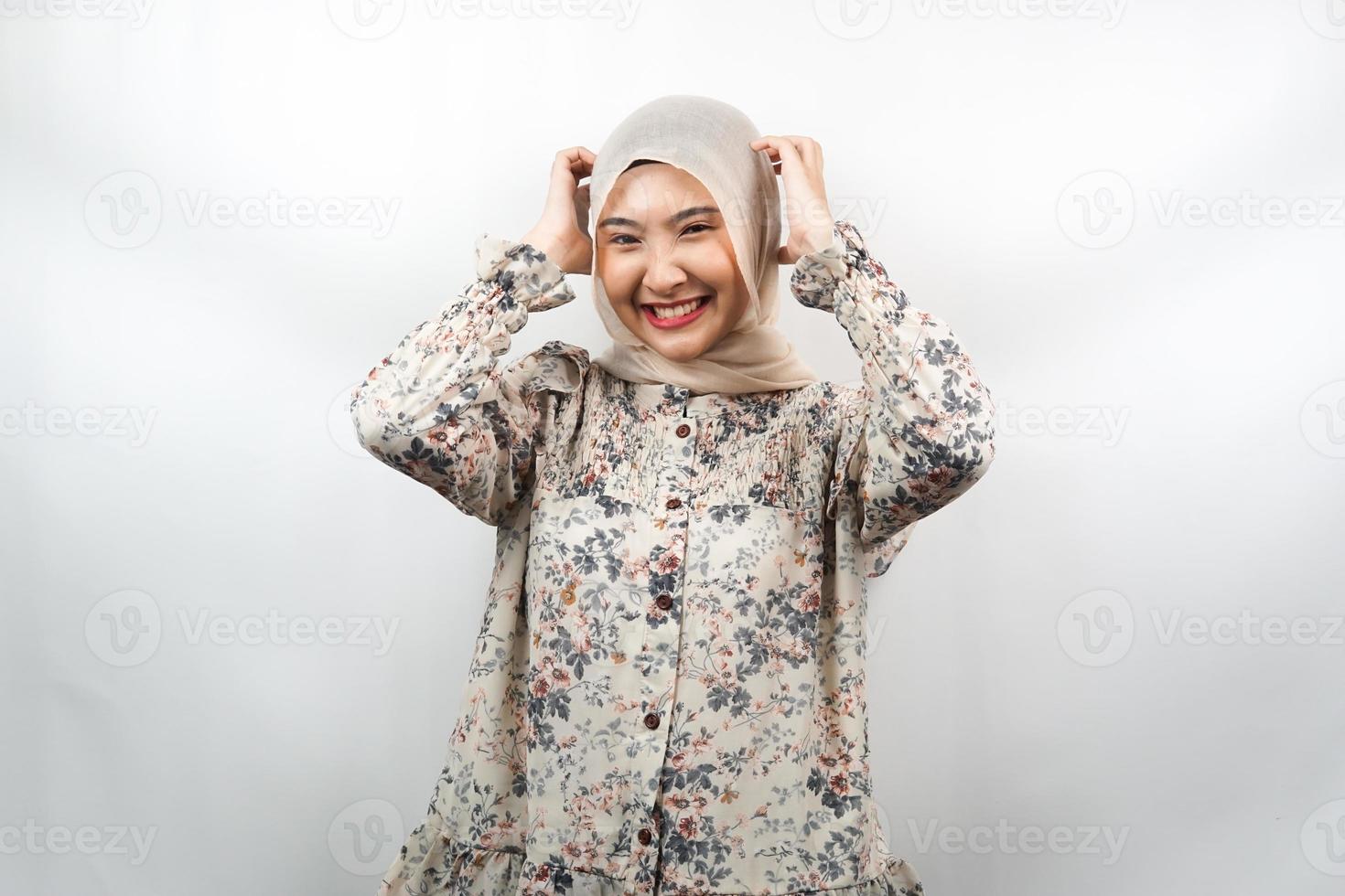 Beautiful young asian muslim woman shocked, dizzy, stressed, unhappy, many problems, want solution, with  hands holding head isolated on white background photo