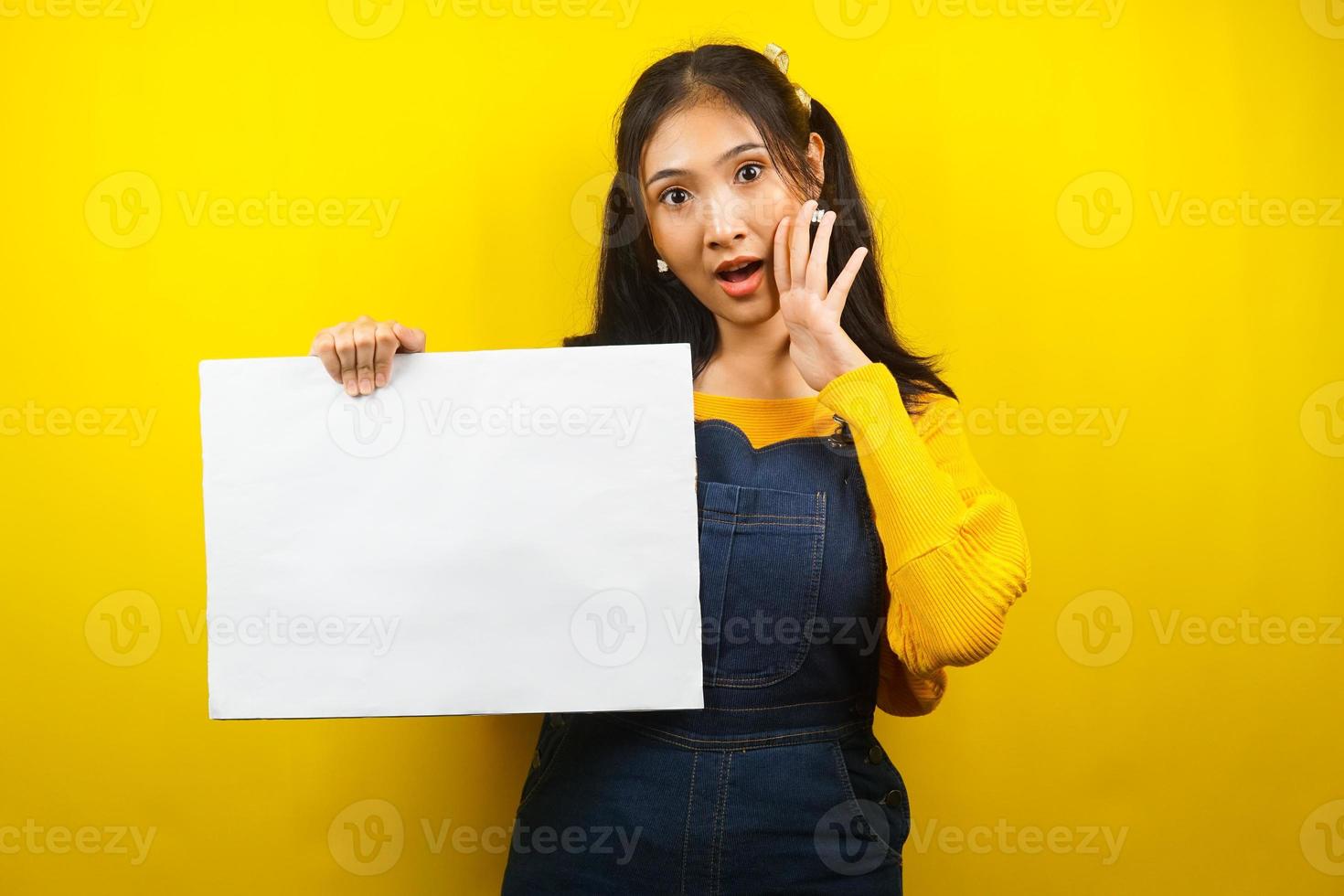 Pretty and cute young woman cheerful holding blank empty banner, placard, white board, blank sign board, white advertisement board, presenting something in copy space, promotion photo