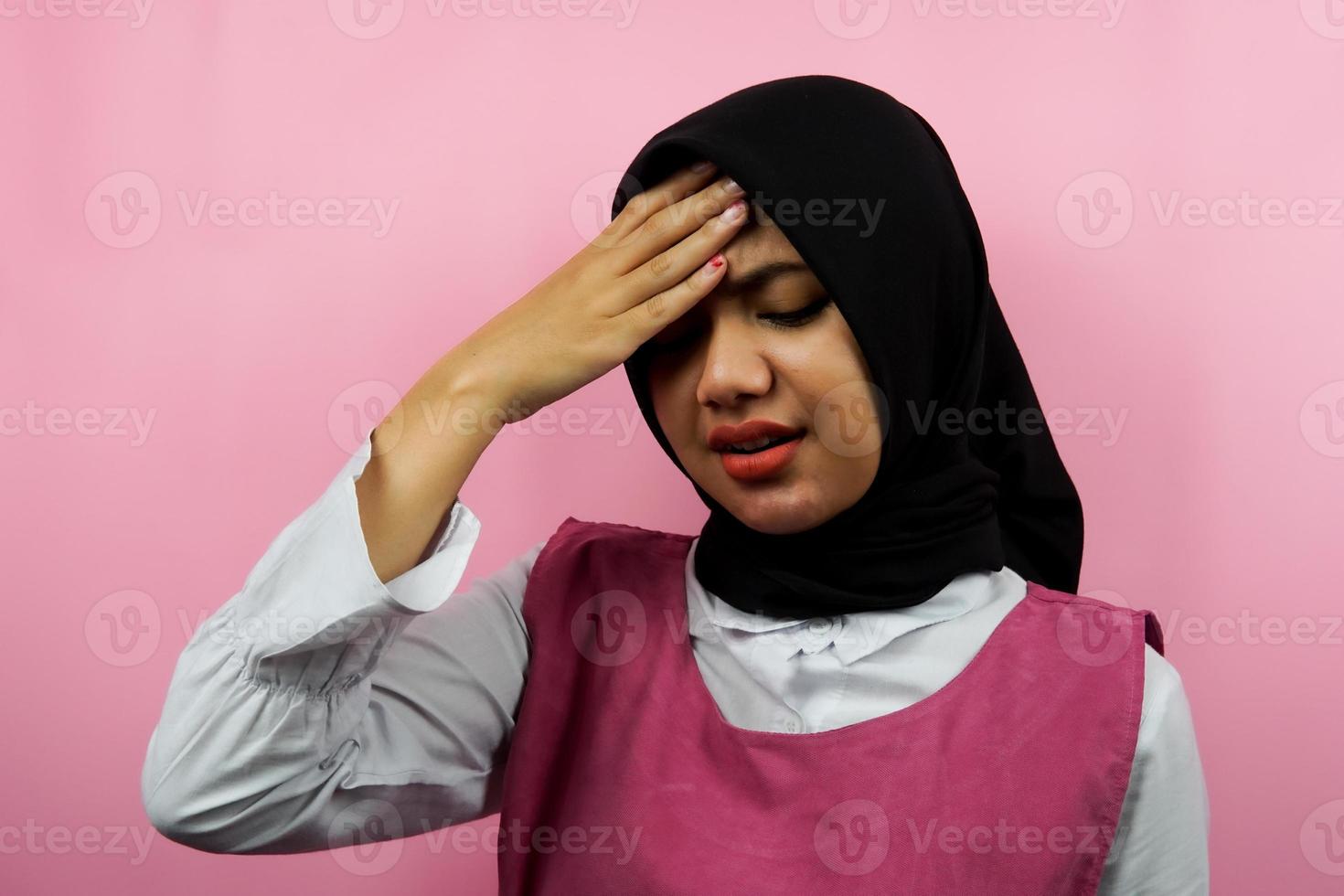 Closeup of beautiful young Muslim woman stressed, panicked, shocked, isolated photo