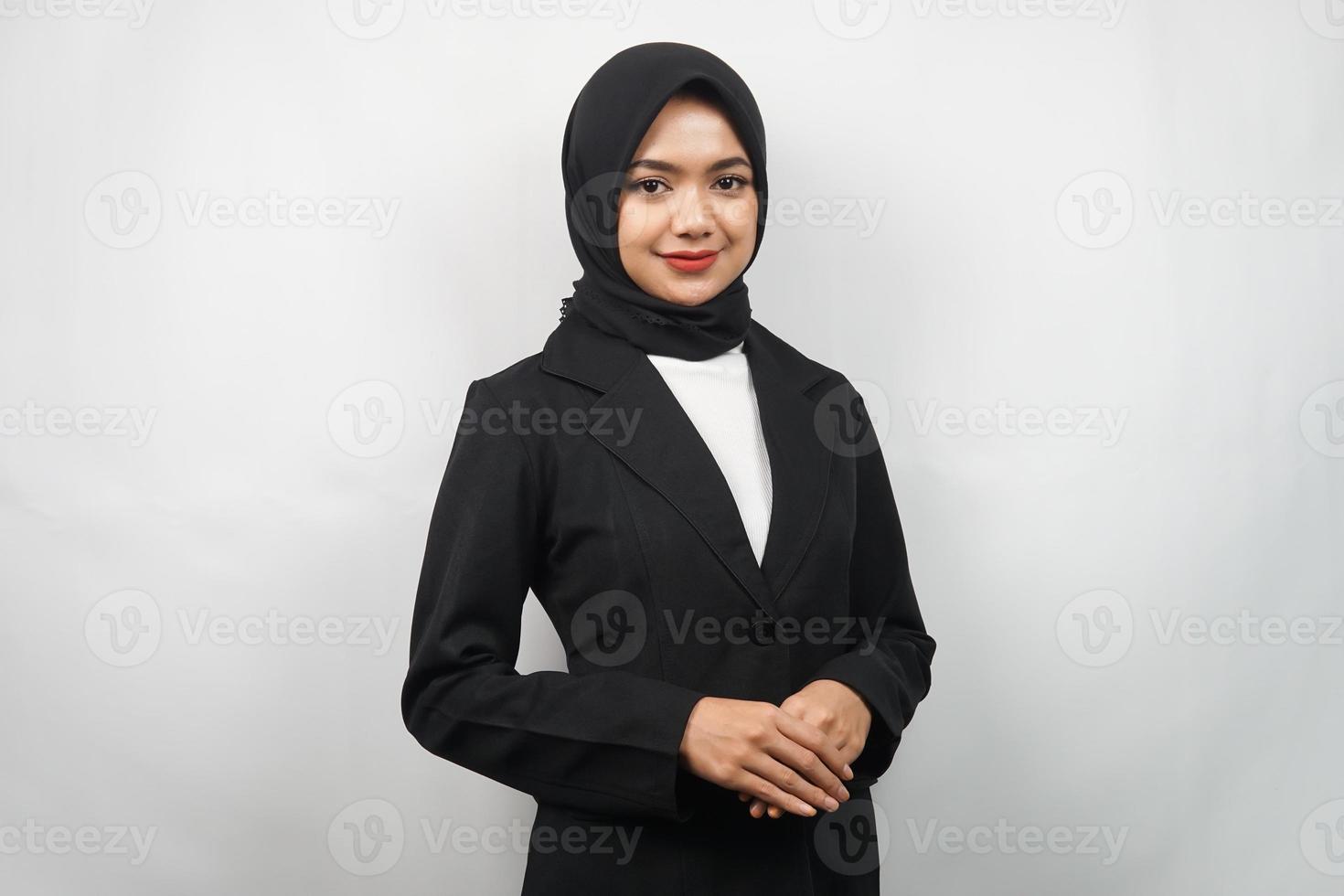 Beautiful young asian muslim business woman confident and smiling, isolated on gray background photo