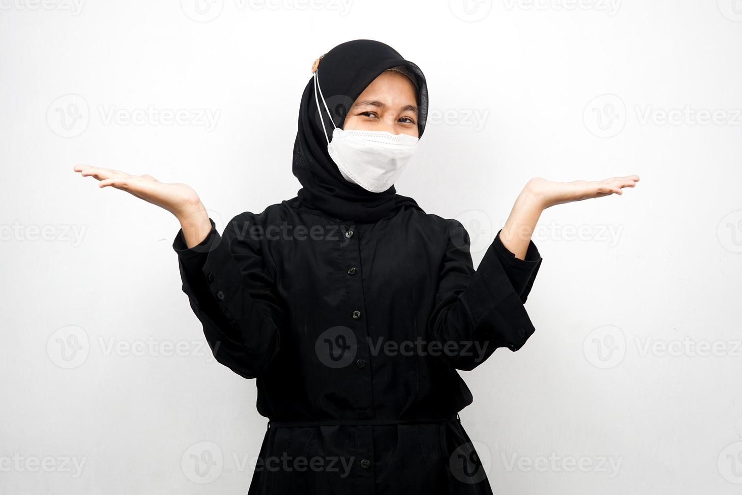 Muslim woman smiling confidently with open palms, presenting something, presenting product, isolated on white background photo