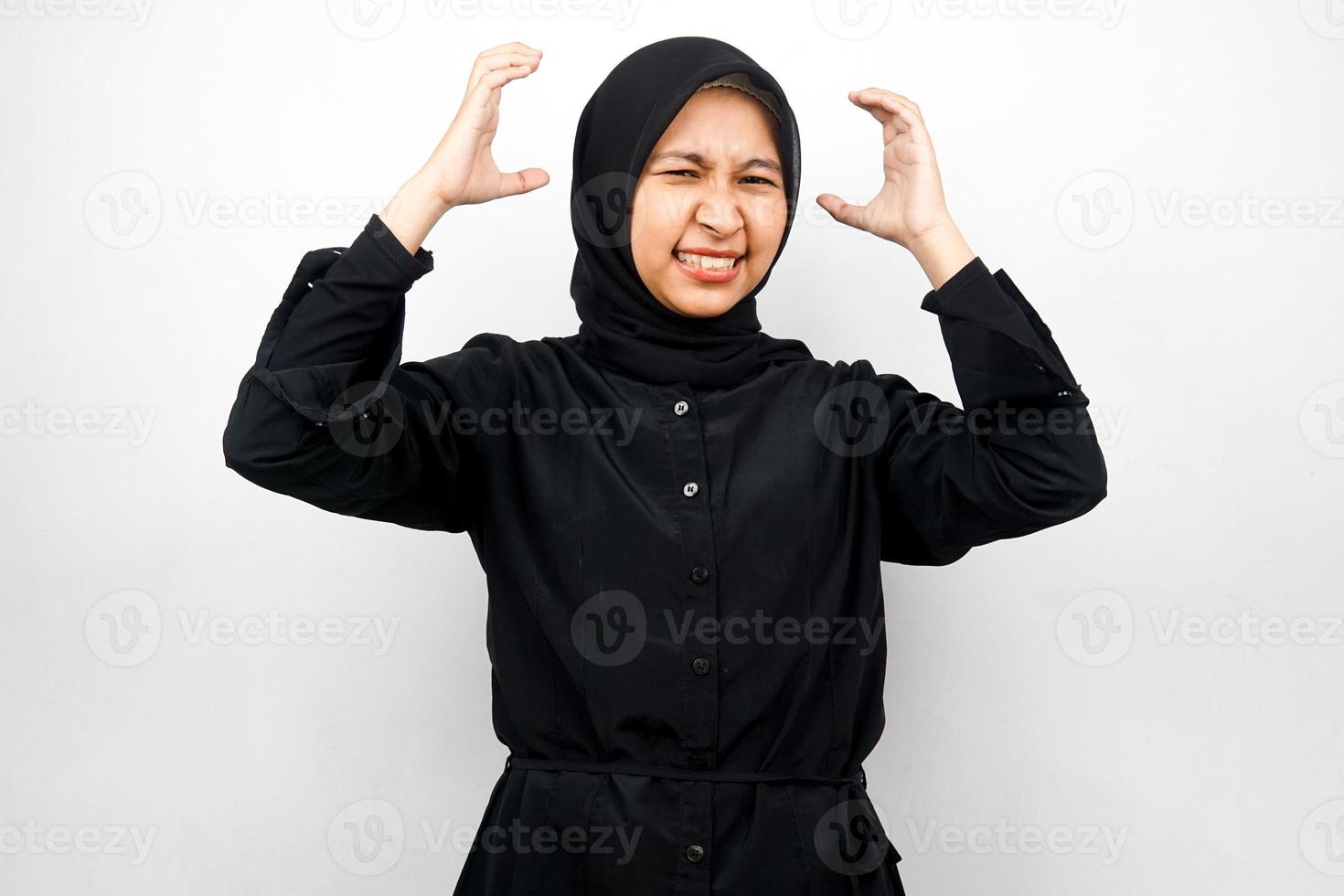 Beautiful young asian muslim woman shocked, dizzy, stressed, unhappy, many problems, want solution, with hands on head isolated on white background photo