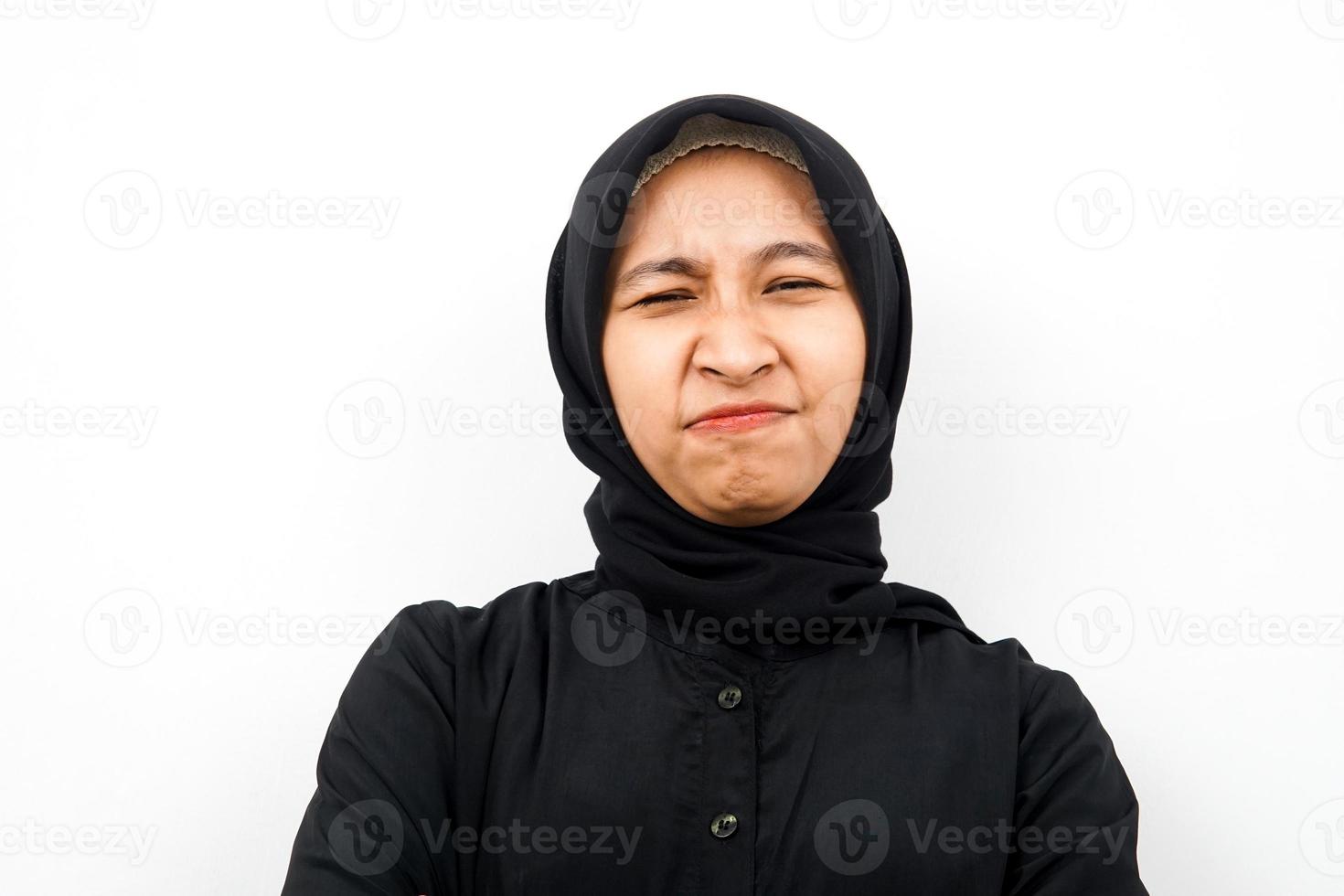 Closeup of beautiful young muslim woman pouting, sad, isolated photo