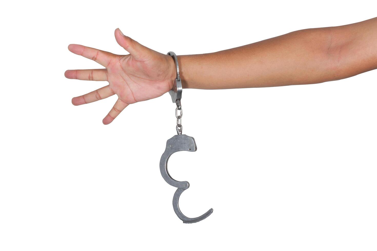 Handcuffs and hand on a white background photo