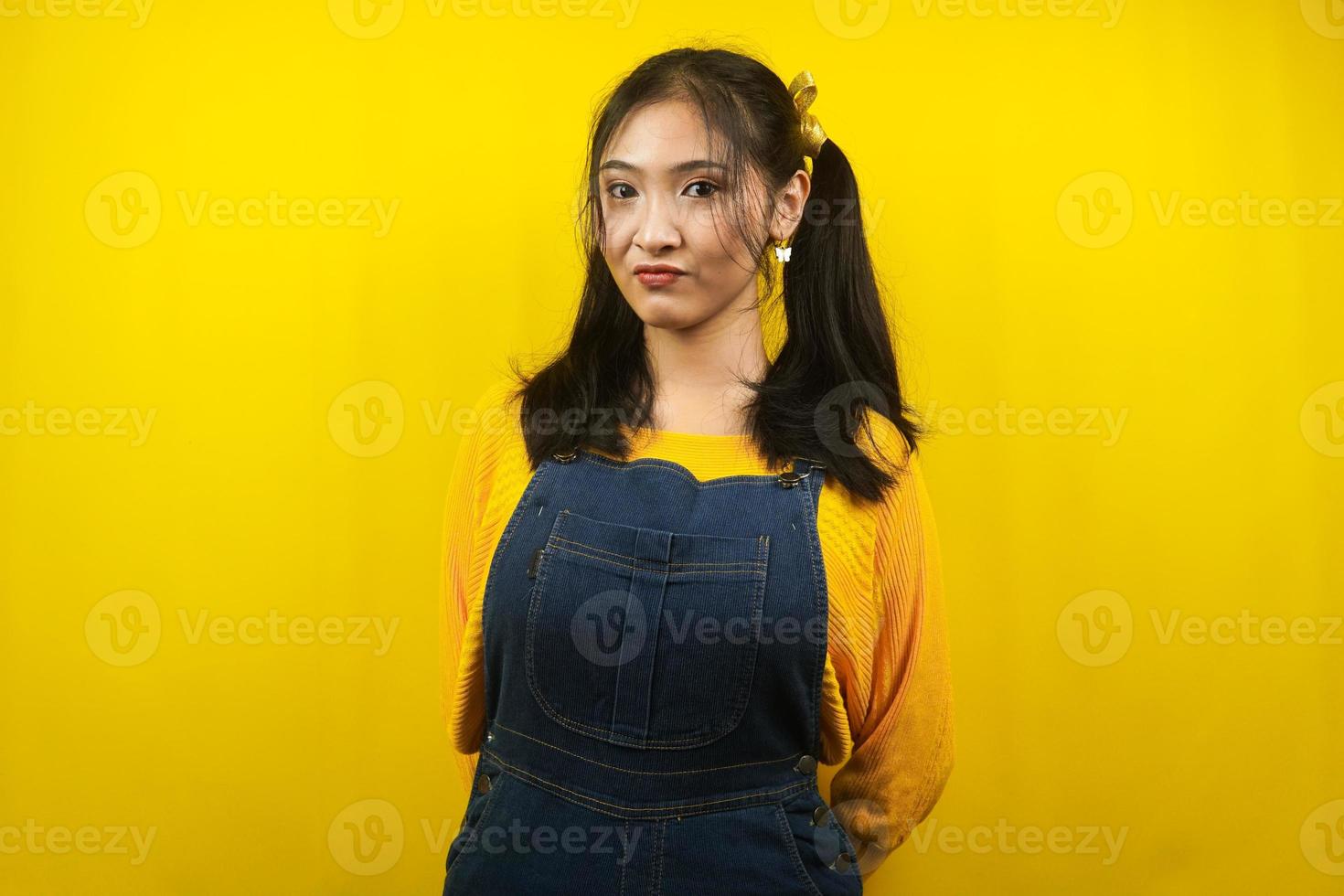 Pretty and cute young woman facing camera, isolated photo