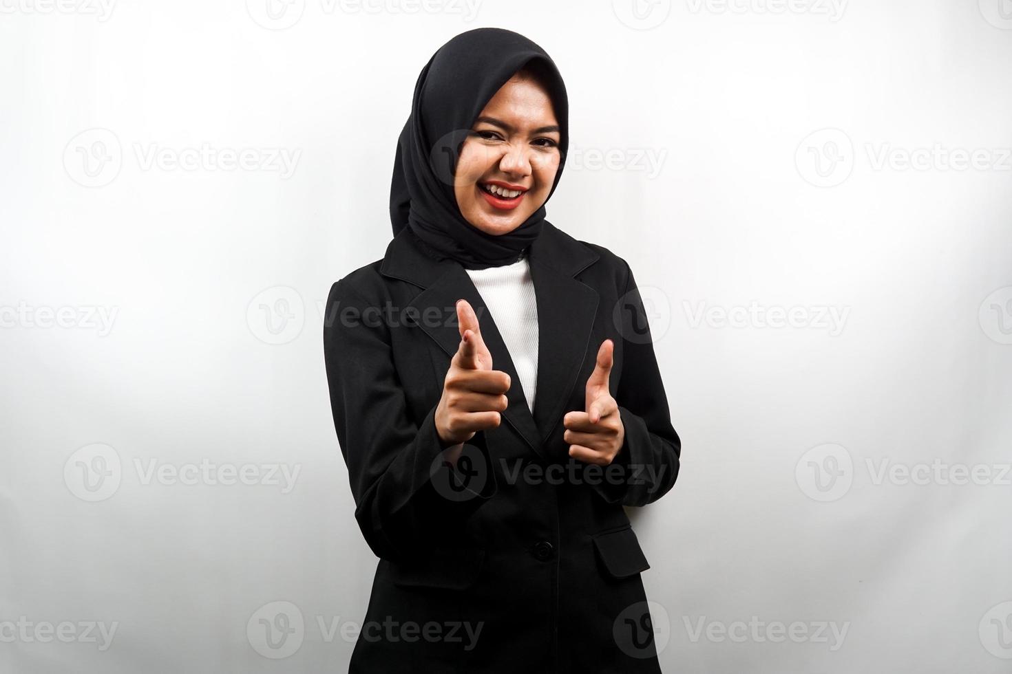 Beautiful young asian muslim business woman smiling confident, enthusiastic and cheerful with hands pointing at camera, hands pointing at audience, facing camera isolated on white background photo