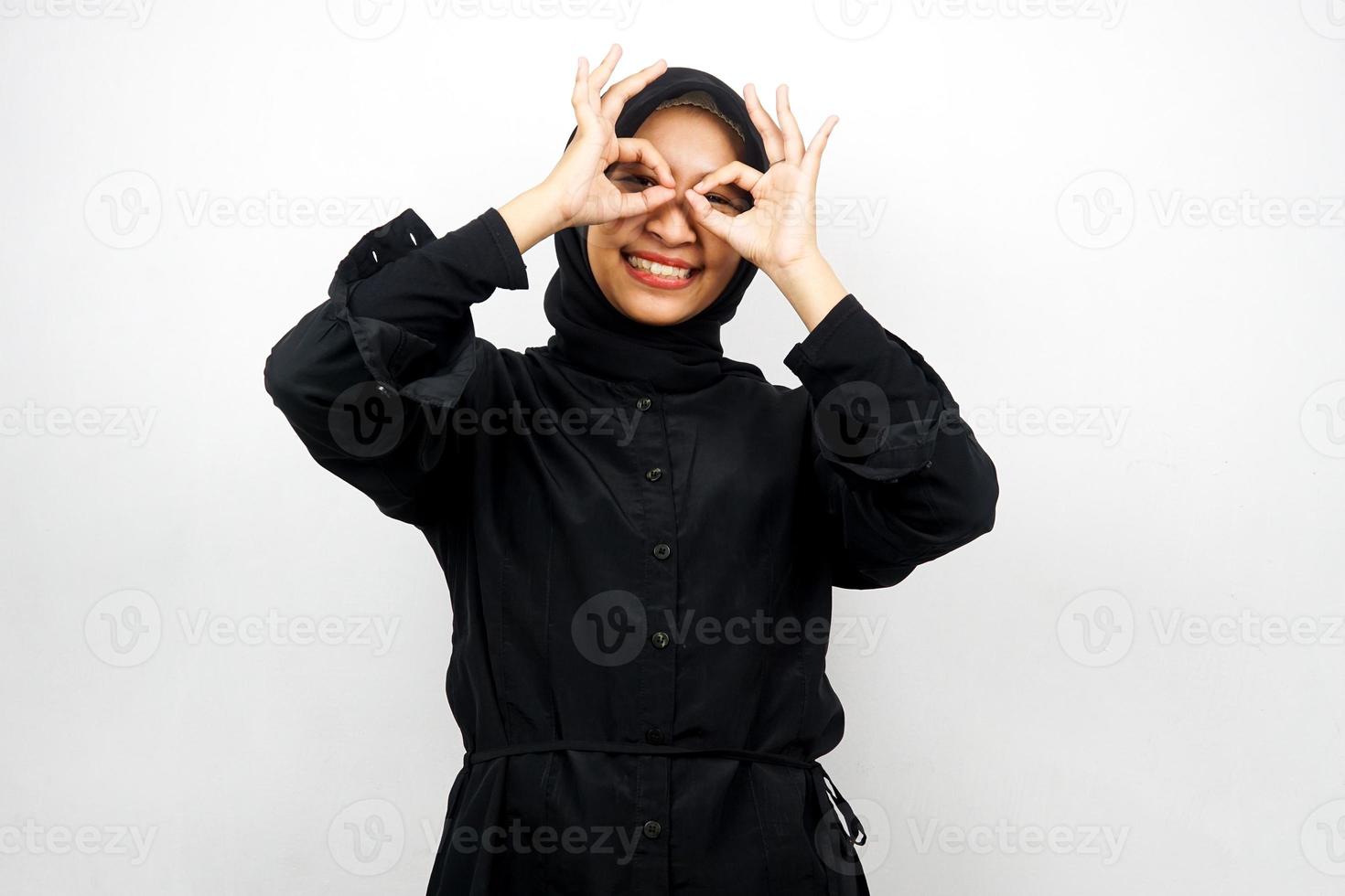 Beautiful asian young muslim woman smiling cheerfully and excitedly, with glasses hands, isolated on white background photo